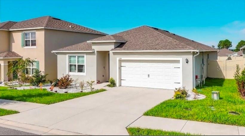 Photo of 1293 Tagliamento Lane, Haines City, FL 33844 (MLS # O6440548)