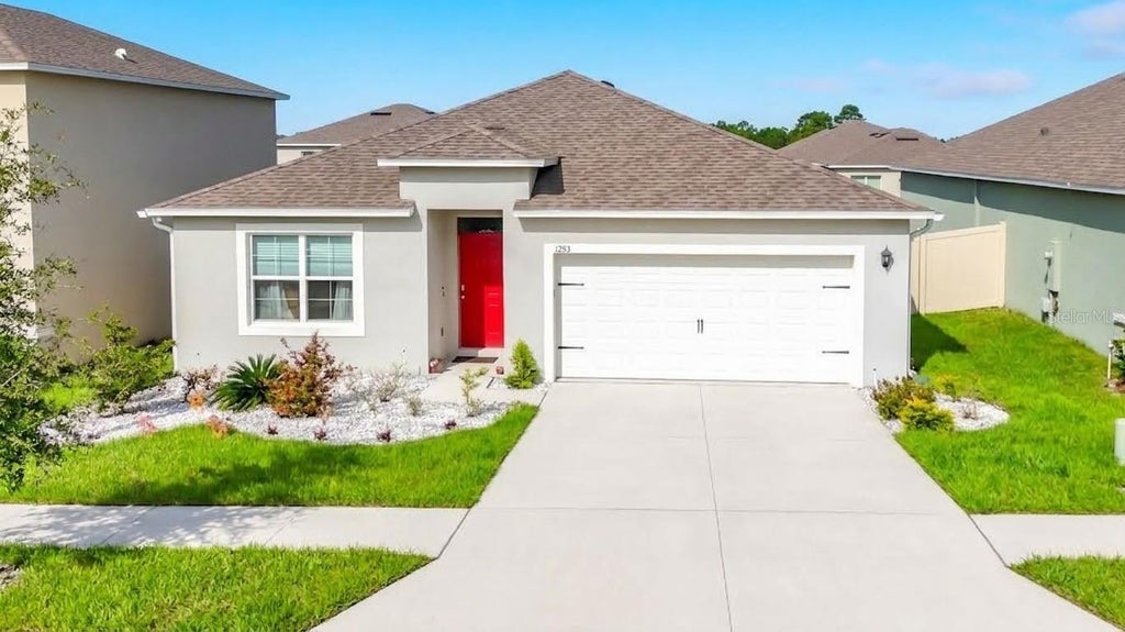 Photo of 1293 Tagliamento Lane, Haines City, FL 33844 (MLS # O6440548)