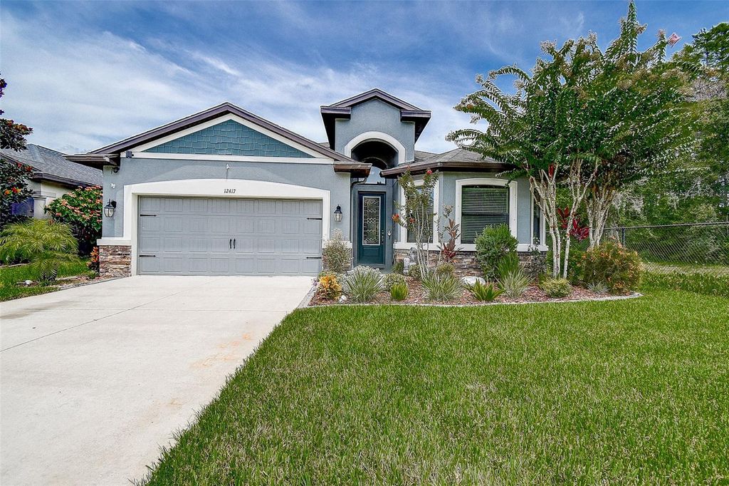 Photo of 12417 Sourwood Way, New Port Richey, FL 34654 (MLS # TB8414142)