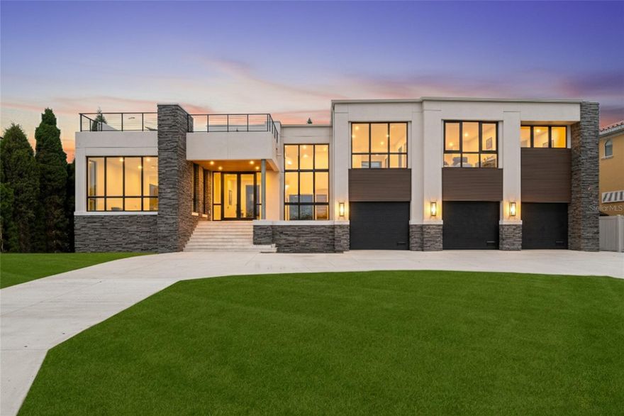 Under Construction. Open Bay views and unseen modern design on Davis Islands. This modern home is built for entertaining and ease of living by Forge Building Co. Enjoy spectacular open Bay views from much of the home with exceptional outdoor living spaces facing front and back. The home features 5 bedrooms, 5 and 2.5 baths, one room is a semi-detached guest suite, and an office, along with two outdoor kitchens: one on the back outdoor living space and one on the rooftop deck. Spectacular modern kitchen with built-in Gaggenau fridge and freezer, Gaggenau cooktop, and three Gaggenau wall ovens. The club room is entered thru pivoting doors and is the ultimate entertaining space. It includes a full wet bar, ice maker, and two built-in subzero 146 bottle wine coolers as well as plenty of room for pool table and has a double sided fireplace. The guest retreat off the Lanai offers a semi-connected bedroom for guests or family to enjoy. A second story "roof top oasis" will offer an amazing and unique space to relax or entertain. The 50'x15' pavered deck will include an outdoor kitchen complete with grill and fridge. Just off the roof top oasis, the semi-private Study with sliding glass doors offers a quiet place to relax or get some work done while enjoying endless open bay views. a bedroom completes the area. Spacious Master bedroom and bath with stunning views as well as private wet bar, private elevator access, sitting room, and fireplace. Separate Media room with fridges and plenty of space for any buildout you desire. Back porch will include an outdoor kitchen and overlook a beautiful pool and spa. Some of the appointments of the home include an elevator, 4 car tandem garage, impact-resistant window walls, almost all 2 story block construction, quartz and marble countertops thru out, built-out closets, and much more! Located on beautiful Davis Islands just across from the walking and bike path and just a short distance away from Davis Islands Village with many restaurants, shops, and bars. Bring your golf cart and enjoy the Island lifestyle with walking / biking paths, baseball fields, public tennis courts, public historic pool, two dog parks (one wet and one dry), a beach, public marina, and an airport. Located only minutes from Downtown Tampa, Water Street, Sparkman Wharf, and the Tampa Riverwalk, makes this neighborhood the most desired in South Tampa!
