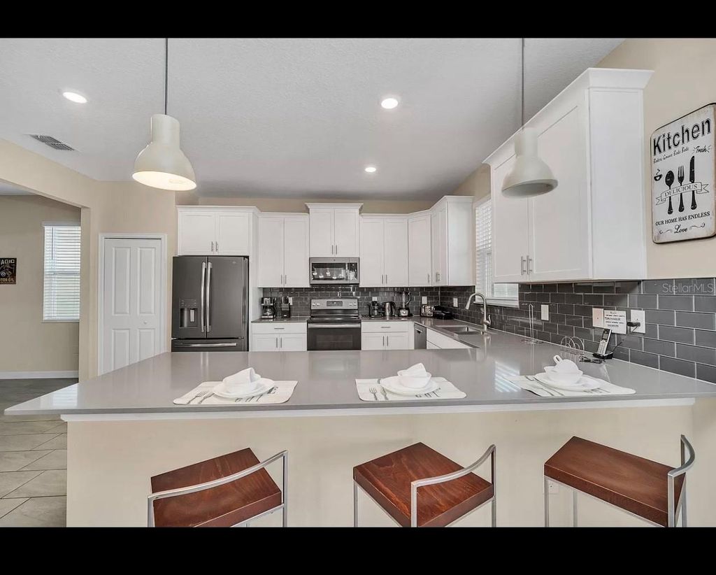 Photo of 740 Drop Shot Drive, Davenport, FL 33896 (MLS # O6397094)