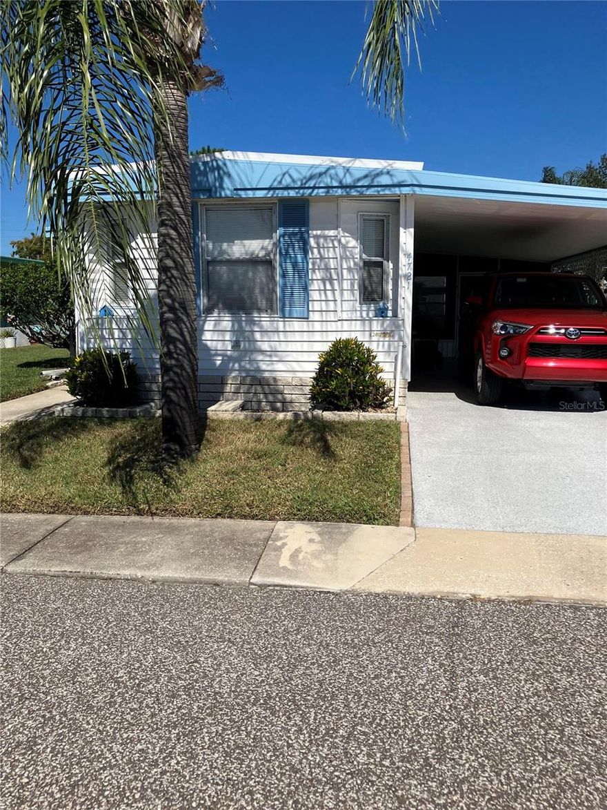 This 2/2 Sunny Florida Lakeview Home beckon you!
Come Enjoy this peaceful, Golfcart friendly 55+ Active Community where you OWN your Own LAND!
The Low HOA monthly fee of $ 143 includes, ground maintenance, Heated Year-Round Pool, Trash removal, Private Road, Clubhouse amenities, etc., 
Short distance of shopping, restaurants, close proximity to Beaches, Historic Tarpon Springs with the famous Sponge Docks, Wine Festival, etc. Easy drive to Tampa or to go North. 
Measurements are approx. Buyer to verify all information that is deemed accurate. Sold As Is. Easy to show/view.