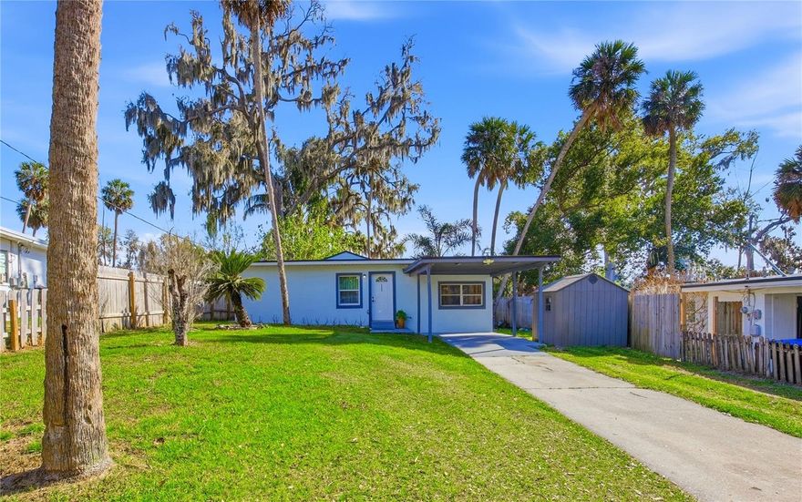 Cozy yet modern, this beautifully updated 3-bedroom, 2-bath home—fully renovated in 2023. With NO HOA,  Ideal for buyers seeking a move-in-ready home with modern updates and manageable monthly costs in a convenient location. Offers the perfect blend of comfort, style, and affordability in Apopka, just minutes from Lake Apopka. Situated on a spacious lot surrounded by mature trees, the property provides privacy and serene greenery views year-round. Step inside to a fresh, thoughtfully designed interior featuring ceramic tile flooring throughout and clean, contemporary finishes. The kitchen serves as the heart of the home, showcasing quartz and granite countertops, wood cabinetry, and a full appliance package that conveys with the sale, with appliances less than one year old. Don’t miss your chance to own this move-in-ready home with privacy, style, and affordable monthly costs!
