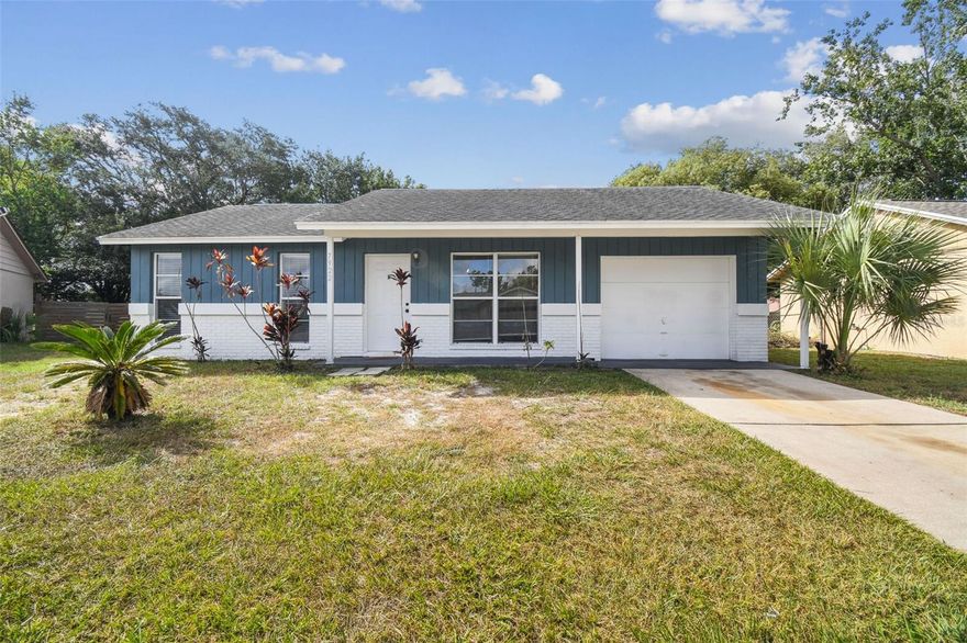 Welcome to this move-in ready 3BR/1BA home in the desirable Seven Springs area of New Port Richey! This charming single-story residence features an open floor plan with ceramic tile and newer carpet throughout. The spacious living area flows into a bright eat-in kitchen with wood cabinets and ample counter space. Enjoy a split bedroom layout for added privacy, and a large, fenced backyard—perfect for outdoor entertaining or pets. Sliding doors off the master lead to a covered patio. Additional features include a 1-car garage, updated bath, and neutral paint tones. Conveniently located near top-rated schools, shopping, dining, and Trinity Hospital. No HOA or CDD! Ideal for first-time buyers or investors. Schedule your showing today!