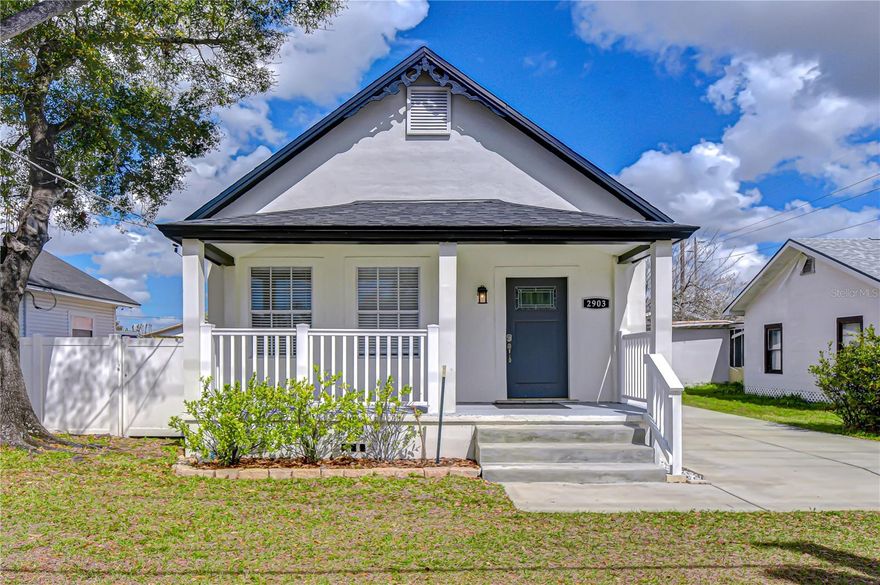 Amazing bungalow centrally located in the heart of Tampa! This beautifully remodeled home blends classic charm with thoughtful updates, making it move-in ready and an excellent opportunity for both homeowners and investors. Major upgrades provide peace of mind, including a new roof (2021), a new A/C system (2021), front and back pavered outdoor areas (2021), new flooring throughout the home (2025), a fully redone front porch (2025), and a newly updated roof over the back porch (2025). From the moment you arrive, the home’s character stands out. The seller preserved the charming awning at the peak of the roof while enhancing the curb appeal with the newly updated front porch—perfect for relaxing and enjoying the neighborhood. Inside, a stunning glass front door welcomes you into a bright and inviting living space. The open-concept layout flows seamlessly into the remodeled kitchen, featuring quartz countertops, stainless appliances, and a stylish hood vent. Natural light fills the home, creating a warm and comfortable atmosphere throughout. The main home features three bedrooms and one bathroom, each with ceiling fans, spacious closets, and ample storage. The primary bedroom is privately located at the back of the home and features French doors leading out to the back deck, offering a peaceful outdoor retreat. The closet also includes convenient washer and dryer hookups. The remodeled bathroom provides additional storage for linens and everyday essentials. A standout feature of this property is the renovated garage that has been converted into a private in-law suite complete with its own bathroom and kitchenette—ideal for extended family, guests, or generating rental income. The backyard offers generous space and could easily be enclosed to create a private outdoor oasis. With its central Tampa location, extensive upgrades, and built-in income potential, this property is a fantastic opportunity you won’t want to miss.
