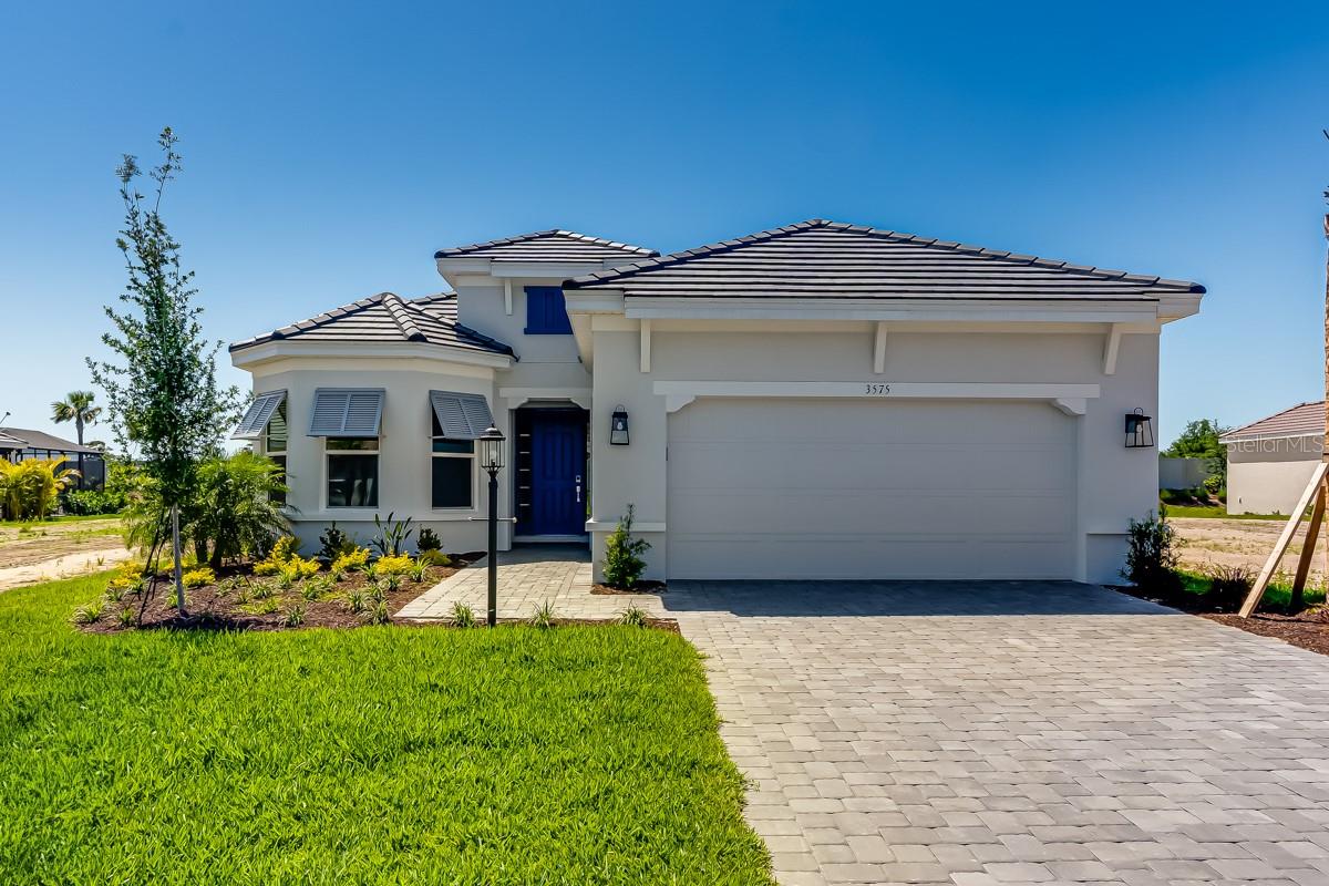 New Construction - Ready Now! Built by Taylor Morrison, America's Most Trusted Homebuilder. Resort-Style Living at Esplanade at Azario Lakewood Ranch, the perfect blend of relaxation and recreation! Enjoy the heated resort-style pool, state-of-the-art fitness center, and energizing aerobics classes. For outdoor enthusiasts, there are pickleball courts, scenic trails, Vitality Park, and if golf is your game, you'll love Esplanade's 18-hole championship course! Unwind with a facial massage or by the fire pit after a workout. Exclusive amenities like a Wellness Center, Culinary Center, and sports courts ensure there's something for everyone, whether you want to stay active or relax in style. The Lazio is one of Taylor Morrison’s most loved floor plans, and it’s easy to see why! With 2,433 sq. ft. of living space, this home offers 3 bedrooms, 3 full baths, a study, and a two-car tandem garage. As you enter through the foyer, you’ll find a welcoming dining room and a spacious great room. The stylish designer kitchen, with its large island, overlooks the great room and features a sliding door that opens to a huge lanai—perfect for enjoying the outdoors. The primary suite is a true retreat, featuring dual sinks, a large shower, a water closet, and a generous walk-in closet. This home has everything you need for comfortable, modern living! Structural options added include: Tray ceiling package, tandem garage, gourmet kitchen, alternate primary suite bay window, casual dining extension, study in place of flex, extended covered outdoor living, 8' interior doors, single pocket doors and double pocket doors. Photos are for representative purposes only. MLS#TB8359912