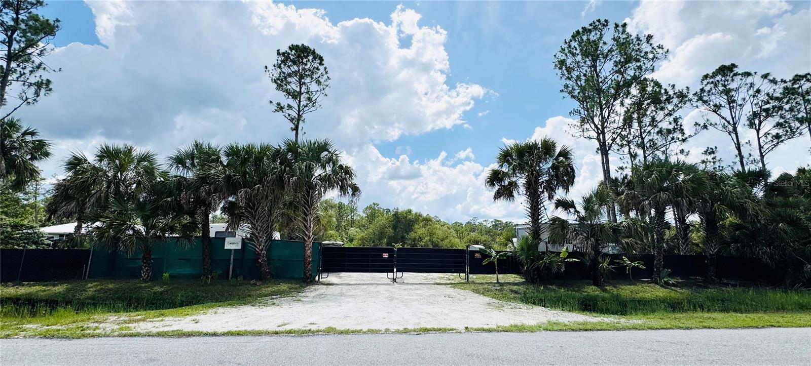 Build your dream estate on this oversized, 3-acre lot in North Port Estates—ideally situated between Tampa and Fort Myers on Florida’s west coast. With no deed restrictions, you can design a spacious home, add a pool, detached garage/workshop, and still have room to store your boat or RV. Surrounded by newer homes, the property offers quick access to top-rated schools, miles of hiking/biking trails, an aquatic park, and the Atlanta Braves Spring Training complex. Shopping, dining, golf, world-class beaches, and three commercial airports are all within easy reach, plus I-75 is minutes away. And with no HOA, CDD, you’re free to enjoy paradise without extra costs. Don’t miss this prime opportunity!