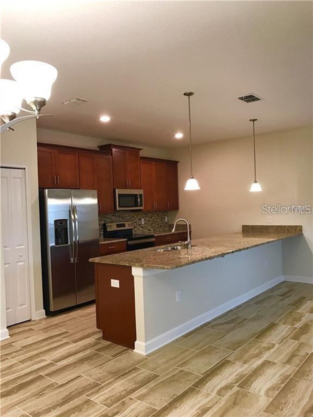 Photo of 1599 Moon Valley Drive, Davenport, FL 33896 (MLS # O6411017)