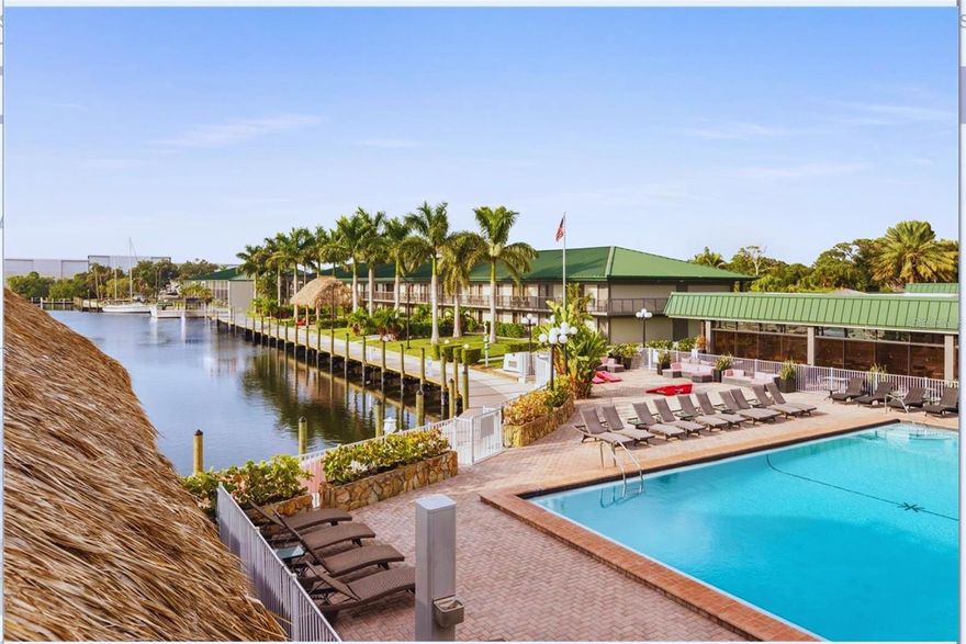 Turnkey investment opportunity or personal vacation getaway—this fully furnished, renovated 1-bedroom, 1-bath hotel-condo is located in the popular Sarasota Cay Club within the Ramada by Wyndham Sarasota Waterfront Resort. Perfect for short-term or long-term rentals, this unit has no minimum rental restrictions and comes with all utilities included in the HOA fee—electric, cable, internet, water, sewer, phone, pest control, and exterior maintenance. Situated on the second floor, the unit features 2 queen beds, a 70" TV, desk, microwave, coffee maker, and a beautifully updated bathroom with a walk-in shower and stone-topped vanity. Stylish flooring and fresh finishes throughout offer a clean, contemporary feel guests will love.

The resort offers a full range of amenities including a waterfront heated pool, on-site Tarpon Bay Grill & Tiki Bar, breakfast café, boat and kayak rentals, fitness center, game room, business lounge, corn hole, and walking paths along the bay. Additional conveniences include optional housekeeping, laundry, and EV charging stations.

Ideally located just minutes from Sarasota-Bradenton International Airport, downtown Sarasota, and world-famous beaches including Lido Key, Siesta Key, and Longboat Key. Also nearby are top attractions like the Ringling Museum, Van Wezel Performing Arts Hall, St. Armands Circle, and IMG Academy.

With strong rental demand, flexible use options, and minimal overhead, this unit is a rare chance to own in one of Florida’s most desirable coastal destinations. Whether you’re a seasoned investor or looking for a second home that pays for itself, this is an exceptional value in Sarasota’s growing short-term rental market.

No rental restrictions. Resort amenities. Fully furnished. All utilities included. Prime waterfront location. Schedule your showing today!