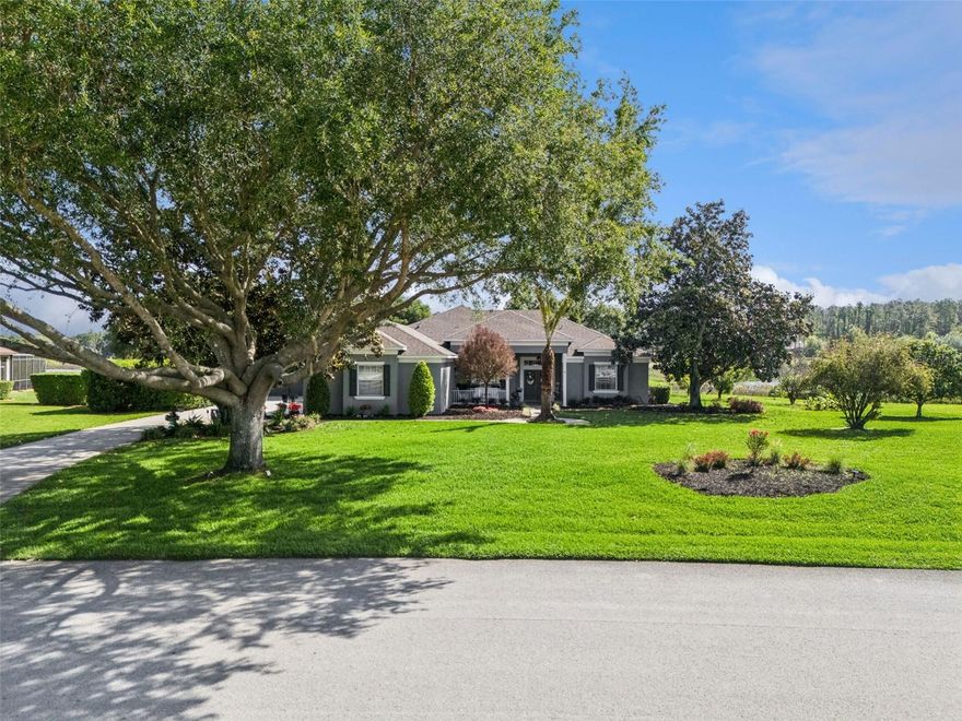 One or more photo(s) has been virtually staged.  Welcome to a rare opportunity to own a Meticulously Maintained and MOVE-IN READY ESTATE in the highly sought-after community of Arrowtree Reserve.  The PANORAMIC VISTA VIEWS are truly nothing like you have ever seen in Florida.  Perfectly positioned you will see WATER from every angle maximizing privacy and serenity.
Designed for true Florida living, everything is on ONE LEVEL and the three way split floor plan offers privacy and functionality for everyday entertaining and also Multi-Generational Living.  
The home offers 2 GARAGES - a 3 car attached garage & a DETACHED 720 square foot heated & cooled space that has a workshop & a built-out office/bonus room.  The flexibility & possibilities are endless with this space.
Inside the upgrades and updates are nothing you will find at this price point.  Custom Woodwork, all new lighting fixtures, granite, LUXURY VINYL PLANK FLOORING throughout (no carpet at all) and built-in fireplace with stacked stone detail.  The kitchen offers true SOLID BUILT CABINETRY, Pull Outs to maximize storage, Soft Close Drawers and Under Cabinet Lighting.  The new appliances have every modern bell and whistle you can think of including the freezer makes 4 different types of ice, hidden chargers on the counter, INDUCTION Stove with Air Fryer and a 44” DOUBLE FAUCET Undercounter Workstation Sink.
Outside you will step into your own PRIVATE RESORT.  A custom designed PEBBLETEC Solar Heated Pool with 3 WATERFALL features is framed by an expansive screen w/ covered Tongue and Groove Wood ceilings. The entire exterior is outfitted with GOVEE lighting so you can have permanent ambiance for the exterior of your home.  The perfect setting for entertaining, game-day gatherings, or relaxing sunset evenings.
Located just 1 mile from Florida’s Turnpike & US-27, you have an easy commute to Downtown Orlando, MCO airport, Disney, shopping, dining, & the Clermont Chain of Lakes. Montverde Academy is only 15 minutes away.
Arrowtree Reserve is known for its acreage homesites, scenic winding roads, and pride of ownership. The community allows detached garages, workshops, RVs, and recreational vehicles, and ultra-fast fiber optic internet is included in your HOA fee. Special Financing Incentives available on this property from SIRVA Mortgage.