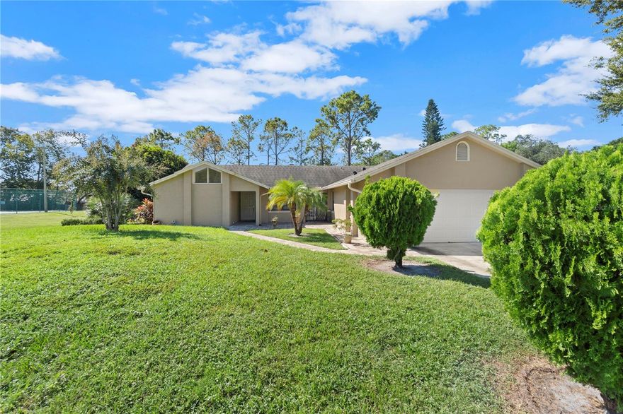 Great opportunity to own this well-maintained 4-bedroom, 2-bath home with a 2-car garage in the desirable Silver Woods community. From the moment you arrive, you’ll notice the lush landscaping and paver walkway leading to the front entrance. Inside, the home features vaulted ceilings, beautiful tile flooring throughout, a formal dining/sitting area, and a spacious family room with a cozy fireplace and wet bar. The kitchen offers granite countertops, plenty of cabinet and counter space, a dinette area, and sliding door access to the paver courtyard. The primary suite includes double-door entry, a walk-in closet, soaking tub, glass-enclosed shower, abundant natural light, and sliding doors to the rear covered porch. The additional bedrooms share a convenient hall bath. One of the highlights of this home is the expansive 51x10 covered, screened porch complete with recessed lighting, ceiling fans, and an outdoor prep bar with sink perfect for entertaining or relaxing. All this in a prime location near Orlando’s top attractions, shopping, dining, and major roadways.