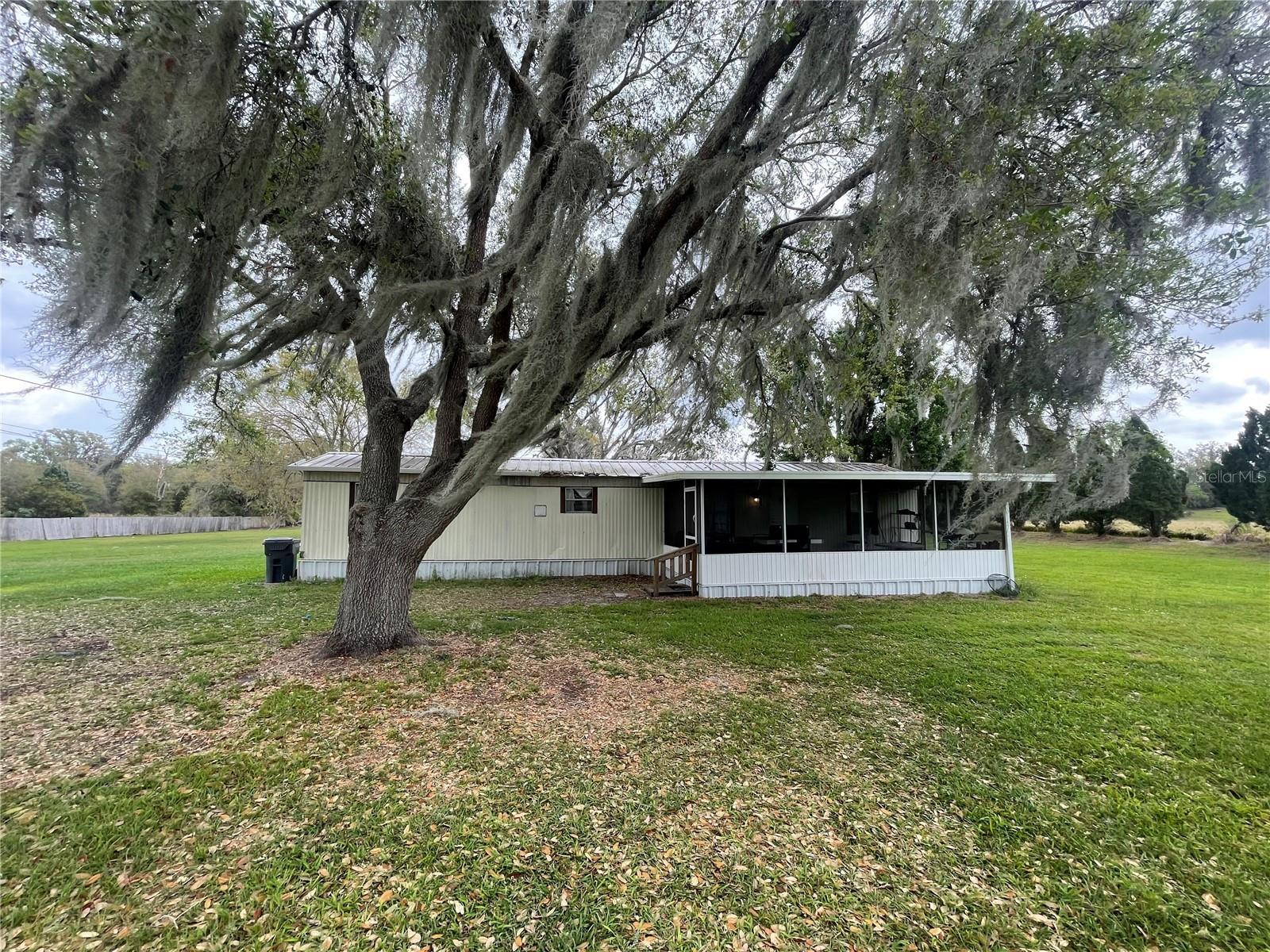 FL living at an affordable price or great investment property! These 2 BD/1.5 BA homes is situated on 0.94 acres. Short distance to all shopping, schools, medical facilities, and restaurants. Make this your new winter retreat or year around home. Call today, don't miss this great investment opportunity.