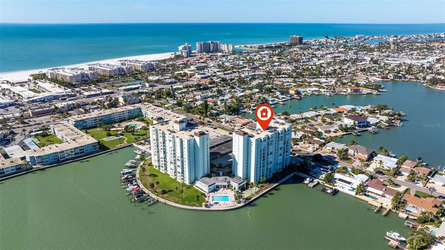 Waterfront living is a lifestyle—and this corner beach residence offers the best views in the building.
Perfectly positioned to capture sweeping, unobstructed panoramic views of the Intracoastal Waterway with nighttime skyline views of downtown St. Petersburg, this 2-bedroom, 2-bath condo delivers exceptional scenery from every room.
The spacious great room floor plan is ideal for entertaining or relaxing, with an updated kitchen featuring stainless steel appliances, modern cabinetry, granite countertops, and a breakfast bar opening to the living and dining areas. The living room opens to the private balcony through high-impact sliding glass doors, where dolphin and manatee sightings are a daily occurrence. Hurricane shutters on the balcony offer added protection, and the corner location allows one side to be enclosed for enhanced privacy—an uncommon and highly desirable feature.
The split-bedroom layout provides comfort and separation. The primary suite includes a walk-in closet plus an additional custom-built closet. The guest bedroom offers two large closets. Both bedrooms benefit from extra corner windows, abundant natural light, and water views rarely found in interior units. All windows and sliders are high impact. Bathrooms have been updated and feature oversized step-in showers.
Three Palms Pointe is a gated waterfront community that has been fully refreshed this year, including updated interiors and an incredible waterside heated pool. Amenities include 24-hour guard service, sauna, fitness center, club room, billiards, shuffleboard, fishing pier, kayak and paddleboard storage, bicycle storage, boat slips (first come), covered parking, additional storage, and complimentary laundry rooms on every floor.
Ideally located within walking distance to the beach, shops, restaurants, and Corey Avenue, with easy access to downtown St. Petersburg and the Cross Bay Ferry to Tampa.
