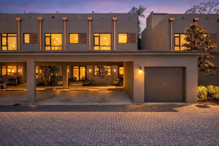 Welcome to this striking 3-bedroom, 3-bathroom ultra-modern loft nestled in a secure gated community, where architectural design meets effortless luxury. From the moment you step into this end-unit townhome, you're greeted by dramatic exposed steel beams, sleek tile flooring, and a statement chandelier that sets the tone for this one-of-a-kind space.The expansive floor-to-ceiling window in the living room floods the home with natural light, complemented by a skylight that brings the outdoors in. Each generously sized bedroom features its own en-suite bathroom for maximum comfort and privacy. Thanks to the 24-foot ceilings, on the second floor loft you will have open air views of the downstairs. Take the stunning spiral staircase to the third floor private rooftop terrace, perfect for entertaining or relaxing under the stars. One bedroom offers peaceful pond views, and with no backyard neighbors, you’ll appreciate the added tranquility. A brand new roof adds peace of mind, while the 1-car garage and additional carport space provide ample parking. With clean modern lines, industrial accents, and thoughtful design throughout, this loft is more than a home—it’s a lifestyle. Just 20 minutes to downtown Tampa, you’ll enjoy quick access to the city while retreating to your private modern sanctuary. Don’t miss this rare opportunity—schedule your private showing today! Seller is offering the option to purchase the majority of the furniture and artwork! **Up to $5,000 towards closing costs with seller's preferred lender! ** INVESTORS - Previous units rented for ~$4,000/mo and it can be sold furnished & decorated!