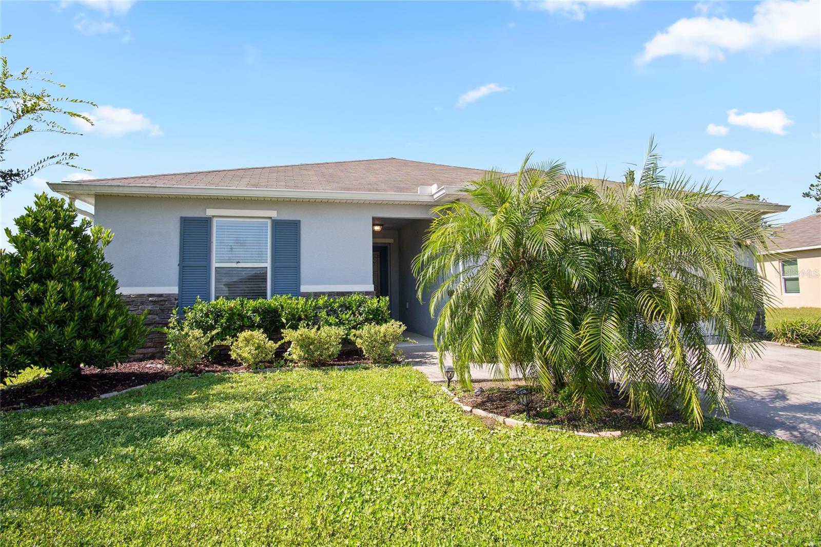 Welcome to your dream home in the sought-after community of Tivoli Reserve in Davenport, Florida! Situated on a fenced corner lot with serene pond frontage, this beautifully maintained 4-bedroom, 2-bathroom home offers the ideal combination of comfort, space, and convenience. Step inside and you’ll immediately appreciate the care and updates throughout — including new wood plank tile flooring in the main living areas and plush carpet in the bedrooms. The spacious open floor plan seamlessly connects the kitchen, dining, and family room, making it perfect for entertaining or everyday living. The kitchen is a standout with quartz countertops, stainless steel appliances, and a large island with pendant lighting, all enhanced by recessed lights and natural sunlight. Just off the dining area, relax on the covered and screened patio, ideal for enjoying your morning coffee or unwinding at sunset with peaceful water views. The backyard is generously sized with room to add your private pool, and the vinyl fence makes it perfect for pets and play. Retreat to the primary suite, where a glitter-accented feature wall adds a touch of magic. The ensuite bathroom features a double vanity, a spacious shower with built-in seating, and a walk-in closet. The three-way split bedroom plan offers privacy for all, and each bedroom includes a ceiling fan for added comfort. Additional features include a guest bathroom with ample counter space and a tub/shower combo, and a stylish laundry room with a new washer and dryer that makes everyday chores feel like less of a task. Tivoli Reserve residents enjoy access to a community pool and playground, and you'll love being just minutes from Central Florida’s world-famous attractions, shopping, dining, golf, and more. Whether you're looking for a forever home or a vacation retreat, this property has it all — location, lifestyle, and livability.