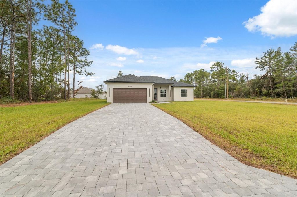 Photo of 5100 SW 155th Loop, Ocala, FL 34473 (MLS # O6359608)