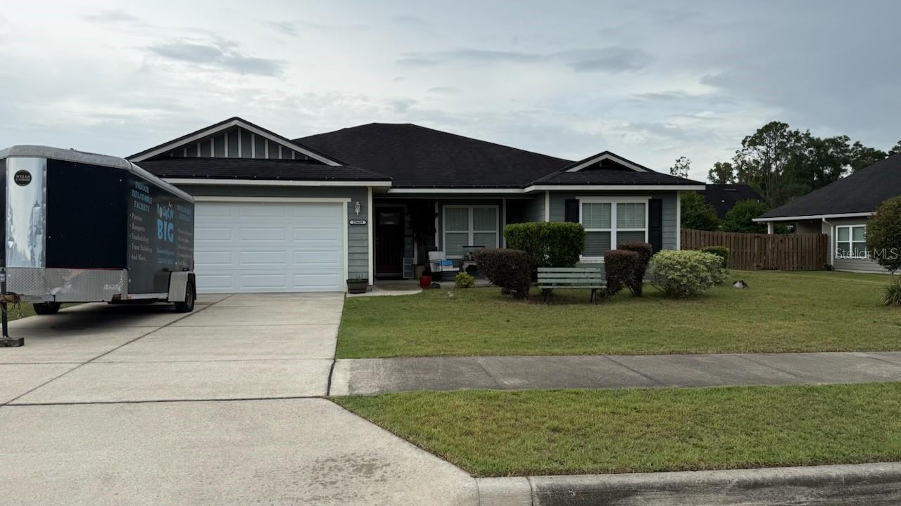 Discover this charming Newberry home featuring a 2-car attached garage. Enjoy comfortable living with electric heating and cooling, plus a recently updated AC compressor. A compact attic above the garage offers additional storage. This property provides a solid foundation for your vision.