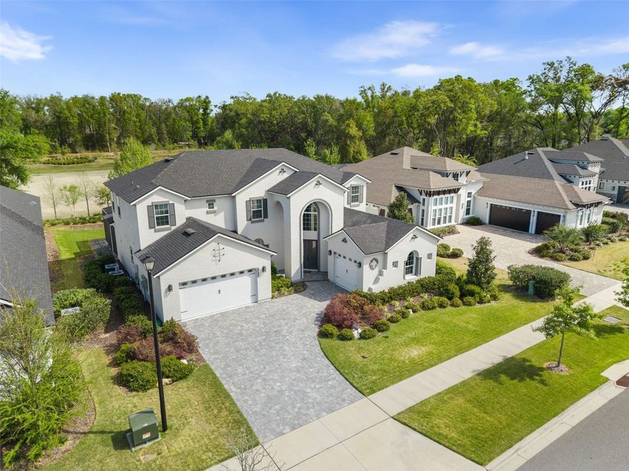 One or more photo(s) has been virtually staged. This is not just another Oakmont listing, it is the only Brooke model on the market, and it was built to stand apart. Positioned on a premium lot and enhanced with over $50,000 in upgrades, this home exudes sophistication at every turn. Set against a tranquil water backdrop, you have no rear neighbors behind you. The second you walk in, you are welcomed with cathedral ceilings, an open floor plan, and three levels of towering windows that perfectly frame the pond, making the view an integral part of the home’s design. Boasting five spacious bedrooms, 3.5 baths, a private study, and an upstairs loft, and 3 car garage, this home offers space to live, work, and play. Every detail has been thoughtfully curated from the upgraded quartz countertops, to the GE appliances (including a microwave and oven that doubles as an air fryer), to the gas stove with a pot filler and generous walk-in pantry. Upgraded LVP flooring flows throughout the first-floor living areas, complimented with tile in the wet areas. Custom window treatments enhance every  room, with plantation shutters at the front, app-controlled power blinds in the living room and primary bedroom and wooden blinds in the upstairs bedrooms.The primary suite is a true sanctuary with an oversized closet accessible from two entryways, an ensuite bath with double vanities and a walk-in shower framed with floor-to-ceiling tile and a stone-accented base with a built-in seat. Extra luxuries you will be sure to enjoy is the separate garden tub and private water closet. Upstairs, you will find two bedrooms on one side and an additional two bedrooms on the other end. One pair of rooms share a thoughtfully appointed Jack and Jill bath, while the other  features a  private guest bath, creating a balanced layout for family or guests. The loft is a unique space that the sellers had specifically walled off intentionally, creating an additional area of privacy. This area is perfect for a gym, media room, or playroom. Step outside to the screened-in lanai with stone pavers, extended 15 feet to create an even better outdoor experience. Beyond the home, residents enjoy the very best of Oakmont’s lifestyle amenities, including one of the largest residential pools, a fully-equipped fitness center, tennis and pickleball courts, basketball and volleyball courts, a playground, and walking and biking trails. Nature enthusiasts will love the unique Gopher Tortoise Nature Reserve with its 2-mile trail. This location has everything you would want or need, whether you’re looking for top rated schools, a quick commute to all major hospitals, or easy access to dining and shopping. Schedule your private showing today!