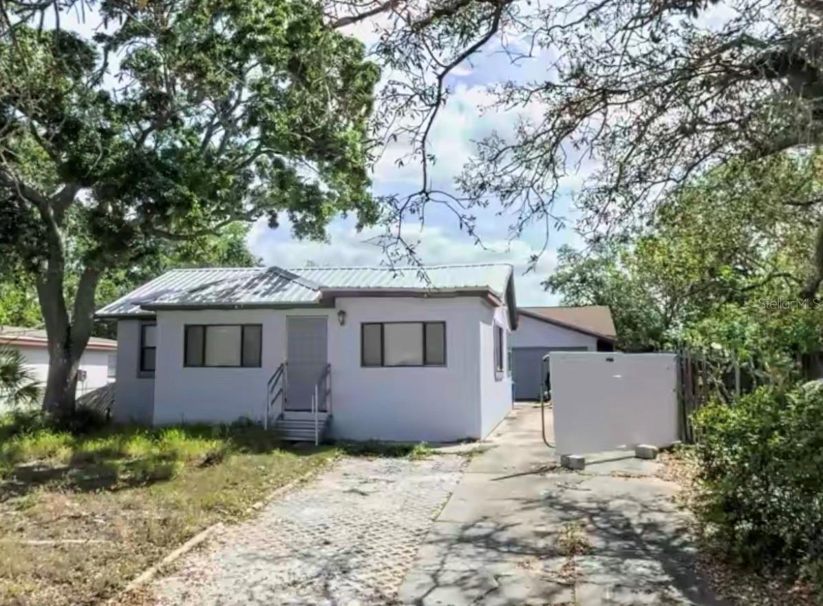 Welcome to 9805 N 46th Street, a cozy 2-bedroom, 1-bathroom single-family home located in the well-established Terrace Park neighborhood of Tampa — just minutes from the University of South Florida, Busch Gardens, Adventure Island, and the Yuengling Brewery.
This charming bungalow-style home offers inviting curb appeal and practical updates. Inside, you’ll find laminate flooring, plantation shutters on most windows, and fresh interior paint that gives the home a bright, move-in-ready feel.
Out back, a large detached two-car garage provides exceptional flexibility — formerly used as a workshop for a classic car collection, it could be converted into additional living space, a studio, or an income-producing unit (subject to local zoning and permits).
The property features a newer metal roof, new well system, and a newer water heater, giving buyers a solid foundation for future improvements.
Offered AS-IS and priced accordingly, this home represents a fantastic opportunity for investors or handy homeowners looking to add value. With a bit of finishing work and updates in key areas, this property has excellent upside potential in a highly desirable location close to everything Tampa has to give.