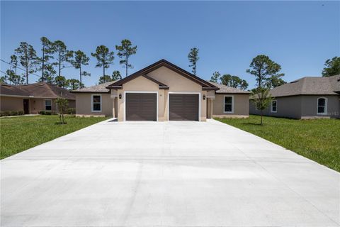 Photo of 39 Regent Lane, Palm Coast, FL 32164 (MLS # FC314030)