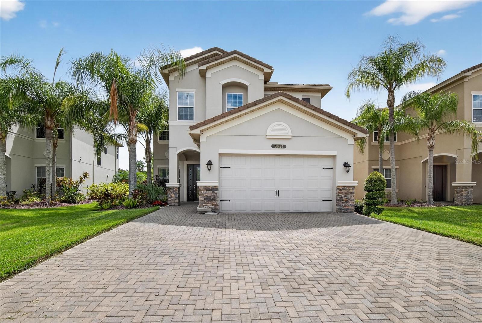 Welcome to The Ridge at Wiregrass, where every detail is designed for elevated living. Behind the gates of this premier community, enjoy resort-style amenities, beautifully maintained surroundings, and the ease of low-maintenance luxury.With lawn maintenance included and reclaimed water keeping utility bills low, this neighborhood offers a beautifully maintained, stress-free lifestyle in the heart of Wesley Chapel.Privately positioned on a serene cul-de-sac, the home captures stunning conservation views and unmatched seclusion.
The kitchen is the centerpiece, boasting custom cabinetry, marble countertops, a natural gas range, and both an eat-in dinette and formal dining area. The spacious open-concept living room flows effortlessly outdoors, where sliding glass doors open to an extended screened lanai with panoramic screens—perfect for relaxing or entertaining. With rough-in plumbing ready for an outdoor kitchen, you’ll be set for year-round al fresco dining.
Additional highlights include a two-car garage with an extended three-car driveway, a new high-end washer and dryer, and even a hidden storage closet tucked beneath the staircase—ideal for safekeeping valuables. Every detail of this home has been carefully designed to maximize comfort, space, and lifestyle.
Whether you’re hosting family gatherings, working from home, or simply enjoying peaceful mornings overlooking the conservation, this property offers the ultimate blend of privacy, practicality, and luxury living in one of Wesley Chapel’s most coveted communities.
The Ridge at Wiregrass delivers an unparalleled lifestyle with world-class amenities, including a state-of-the-art fitness center, lap pool, resort-style pool with waterslide, splash zone, playgrounds, tennis and basketball courts, a community pavilion, media room, and a beautifully appointed clubhouse for private events. Families will appreciate being zoned for top-rated, highly sought-after schools, while multiple gated entrances ensure both convenience and peace of mind.
Perfectly positioned with easy access to I-75 and I-275, this community places you within minutes of Wiregrass Mall, The Grove, KRATE at the Grove, Tampa Premium Outlets, Cooper’s Hawk Winery & Restaurant, leading healthcare facilities, and endless dining, shopping, and entertainment options. At The Ridge, every day feels like a retreat—where comfort, convenience, and connection come together seamlessly. Your dream home and lifestyle await at The Ridge.