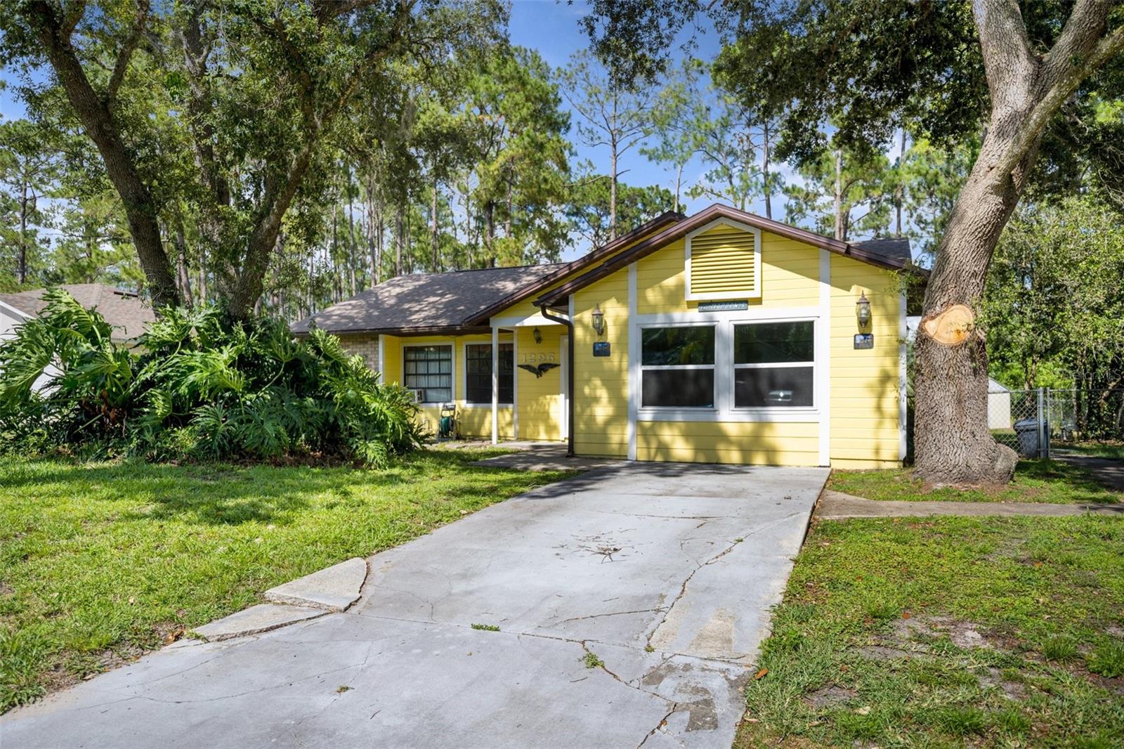 Welcome to your adorable new Florida bungalow! The first thing you’ll notice is the warm, sunny yellow color of the home with a very welcoming front stoop. Pull up into your long driveway and get ready to be amazed! This home has been meticulously maintained by its previous owners and now updated by its current owner who inherited the property. Once you enter you’ll smell FRESH new paint and see the flawless off-white walls of the living room that greets you. Imagine where you’ll put your couch where you will rest your legs after a long day! This room feels extra spacious thanks to the vaulted ceilings. Immediately to the right, you can enter bedroom #3 that used to be the garage! Brand new windows were installed 2 years ago to give you tons of natural light if you wish to use this room as an office, or it has a huge closet to make for the ideal bedroom! Right outside of this room is your massive walk-in laundry room which can also be used for storage. Here you’ll find your brand new water heater from 2021, along with washer and dryer that do convey. Once you pass the immaculate laundry room, you can walk right into your spacious master bedroom with a spacious closet as well as a linen closet. Your ensuite bathroom offers an open vanity space and a handicap accessible shower with grab bars. Conveniently enough, this places a bedroom directly next to your master which would be perfect for a nursery! Enough about this side of the house, lets head over to the left where you’ll find bedroom #2 and an accompanying full bathroom. The vanity was recently installed and this shower offers grab bars for extra handicap access as well. A linen closet is located conveniently right outside of the bathroom. Walking out and turning left will bring you directly into your kitchen that had a recent remodel in 2021! With updated appliances, gorgeous granite countertops and reliable tile flooring, your kitchen can withstand all. Tons of cabinetry, an ensuite pantry, and even a space for a little coffee/wet bar if you wish! Attached to your kitchen is another living room/formal dining room/Florida room.. whatever you wish it to be! You can sit here and drink a beverage and enjoy the pool view or the dogs playing in the background. Which brings me to the backyard! Tons of privacy with fencing all around and lots of gorgeous trees bringing shade, but not too much shade, you have lots of space for entertaining, furry friends, whatever you desire. The screen enclosure is well cared for as is the giant pool, just in time for Summer! The shed also conveys and has a cement floor and a generator. If you’re not sold yet, there’s more: roof is 2 years old and was recently professionally cleaned. All paint that is not brand new is only a year old. A/C is in great condition as the sellers were from New England and truly did not use it much. Owners absolutely loved the neighborhood. Septic is from 2004 and regularly pumped. Come and see her before she is gone, this is a Deltona gem!