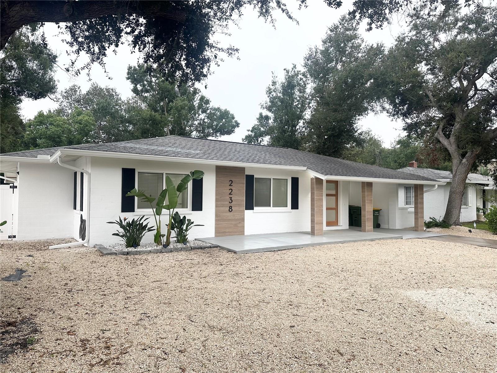 You'll want to see this home before your rent another. Located in the highly desirable Arlington Park area by the Sarasota Memorial Hospital. A beautiful fully updated 2 bedroom and 2 bath home. Shows like new inside with everything done in 2024-2025. Home features new custom kitchen cabinets, quartz countertops, deep sink, new appliances, dimmable lighting, new bathrooms with large soaking tub in master bath, new windows, new fans, new doors, new porcelain tile floors, new gutters, large carport, and an extra large laundry room. Home is located on a large lot along a quiet street and includes privacy shrubs around the front of the property with two drive entrances. The home also includes a new 6 foot vinyl fence in the rear yard with side gates. The home has all new paint inside and out. Just a few blocks from Arlington Park with paved walking trails, tennis courts, swimming pools, and more. You'll love the location. Close to downtown and Siesta Key Beach.