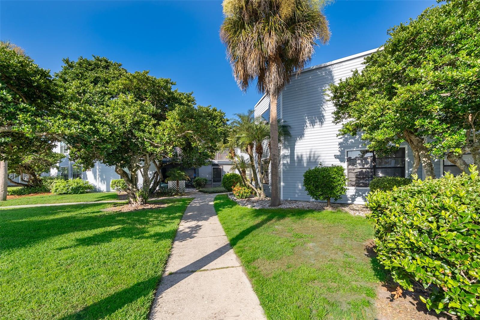 Welcome to this beautifully updated 2-bedroom, 2-bathroom second-floor condo in the highly sought-after Southpointe Condominium Community, located within the secure, gated Ventura Country Club. Offering a perfect blend of comfort, style, and convenience, this home features a thoughtfully designed open floor plan with cathedral ceilings, ceiling fans, no carpets, and all-new vinyl flooring installed in 2020—making it perfect for homeowners or investors alike. The updated kitchen boasts sleek cabinetry, solid surface countertops, modern appliances, a double oven, and decorative lighting. The primary suite offers a spacious walk-in closet and an ensuite bathroom with contemporary fixtures and upgraded cabinetry. The additional bedroom provides flexible living space, ideal for family, guests, or a home office. The fully renovated guest bathroom (2024) features high-end tilework and a modern vanity. A sliding glass door opens from the living area to the private screened-in porch, creating a peaceful retreat to enjoy the Florida breeze. Additional recent upgrades include a newer A/C system (2023) with a UV light for enhanced air quality—perfect for allergy sufferers—and a newer water heater (2023), contributing to both comfort and energy efficiency. Southpointe residents enjoy exclusive access to two private community pools—one of which is heated—as well as a hot tub. As part of the larger Ventura Country Club, you’ll also enjoy resort-style amenities including a championship 18-hole golf course, driving range, tennis and pickleball courts, shuffleboard, Olympic-sized pool, ballroom, and an expansive clubhouse featuring a restaurant/bar, fitness center, card room, and library. Outdoor enthusiasts will also enjoy Lake Frederica with beach access, a gazebo, a charcoal grill, and benches. Ideally located just 5 miles from Orlando International Airport and only minutes from downtown Orlando, major highways, shopping, dining, and world-renowned theme parks, this condo combines comfort, convenience, and resort-style living!