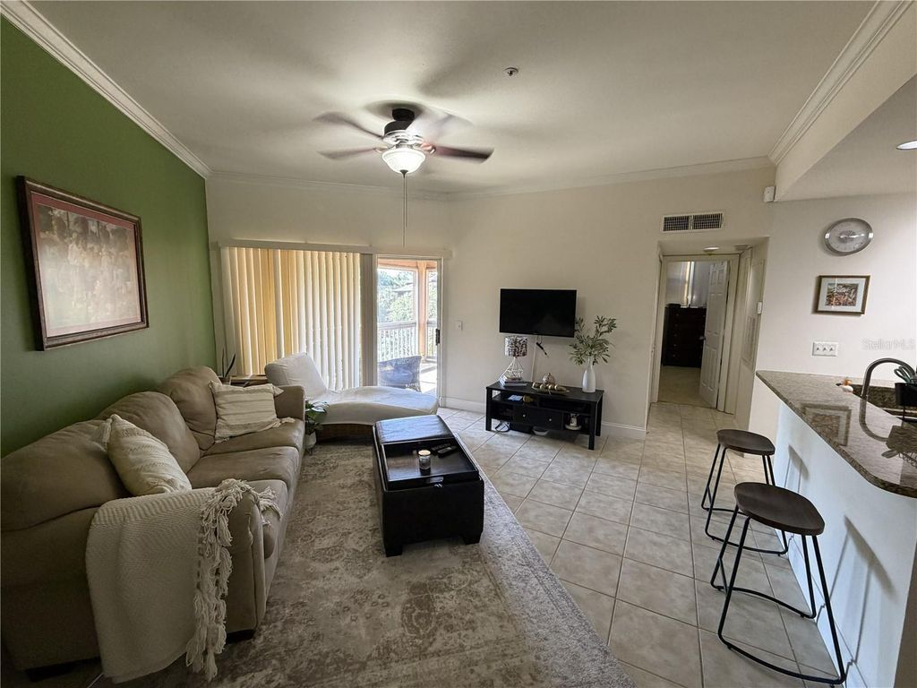 Photo of 498 N Pin Oak Place #306, Longwood, FL 32779 (MLS # O6399772)