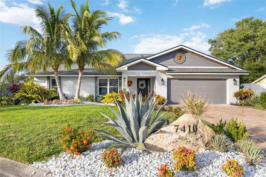 Welcome to one of the most breathtaking homes you will ever find in Northwest Bradenton. If you have been looking for that perfectly renovated property that you wouldn't want to make a single change to, look no further. You have found it. Boasting high vaulted ceilings, luxury vinyl plank flooring throughout, storm windows, 2 car garage, large interior laundry, wide open living spaces and a true split floorplan, this home will check off all the boxes. Other updates include a 2022 roof, 2021 Wi-Fi capable water heater, 2023 electric panel and recently refinished and retiled pool/spa combo. The yard is beautifully landscaped and easily maintained. The kitchen is a chef's dream, complete with dry bar, built in wine racks, oversized island that seats 6, double built in ovens, Bosch refrigerator, matching stainless appliances and farm sink. The gorgeous granite and custom dovetail white shaker cabinetry that ties the whole ensemble together continues into the living room with a gigantic built in TV stand that offers even more storage. In addition to the traditional living room there is a secondary family sitting area conveniently located surrounding the wood burning fireplace. Recessed lighting, LED backlit display shelves, designer ceiling fans and light fixtures add to the luxurious feel in the living dining kitchen combo. On the west end of the home you will find two large bedrooms with a shared bathroom that has been fully remodeled. On the opposite end of the house you will find the primary suite with a very large walk in closet and newly remodeled bathroom with gorgeous tiled shower and dual sink vanity. As you exit the hideaway sliders into the covered back patio, you will quickly realize that your outdoor oasis is just as impressive as the interior. Tons of covered patio space along with an outdoor shower, screened in pool cage and fully fenced backyard will have your friends and family begging you to come hang out everyday. Perfectly situated in the highly sought after neighborhood of Woods of Palma Sola in one of the most secluded cul-de-sacs in the neighborhood, the property is only a two minute drive to the Publix and the soon to be completed Target complex. It is also a cool 5 miles to the award winning beaches of Anna Maria Island. This home is bound to gather a lot of interest. So don't miss out on the opportunity to own your own little slice of paradise.