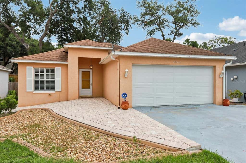 Photo of 8711 Busch Oaks Street, Tampa, FL 33617 (MLS # TB8534237)