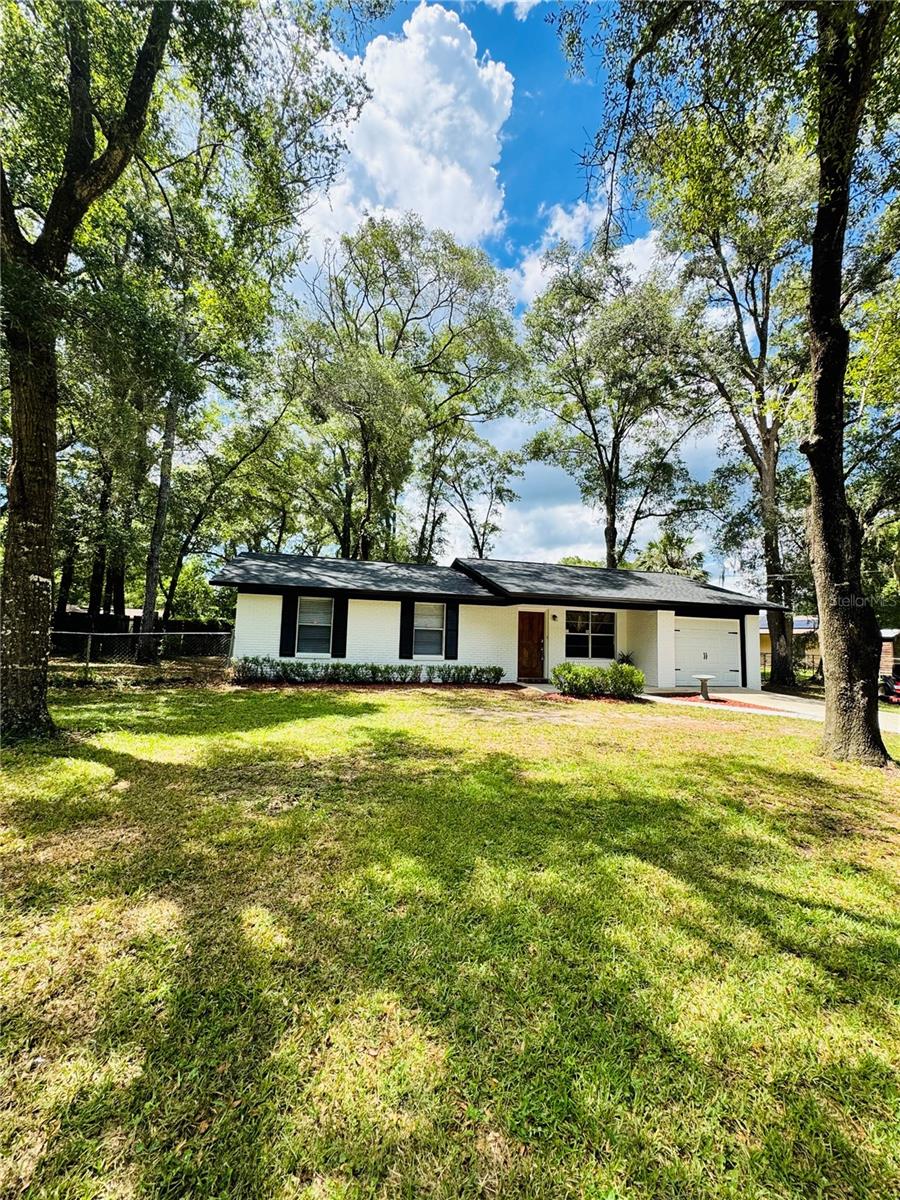 This beautiful move-in ready 3-bedroom, 1.5-bath home offers style, comfort, and value in one perfect package. Sitting on an oversized lot, there’s plenty of room for outdoor living, gardening, or future additions. Inside, you’ll love the brand-new luxury vinyl plank flooring throughout, fresh paint inside and out, and modern light and bathroom fixtures that give the home a bright, updated feel. Enjoy peace of mind with big-ticket upgrades already done — a new roof in 2025 and a new water heater in 2024. The home’s layout offers a welcoming living space, a functional kitchen, and comfortable bedrooms, making it ideal for a primary residence, vacation getaway, or investment property. Located less than 5 minutes to the crystal-clear waters of Rainbow River and only 15 minutes to Ocala, you’ll be close to shopping, dining, hospitals, and endless outdoor activities. With its prime location, modern updates, and competitive price, this home is ready for its new owner — act fast before it’s gone!