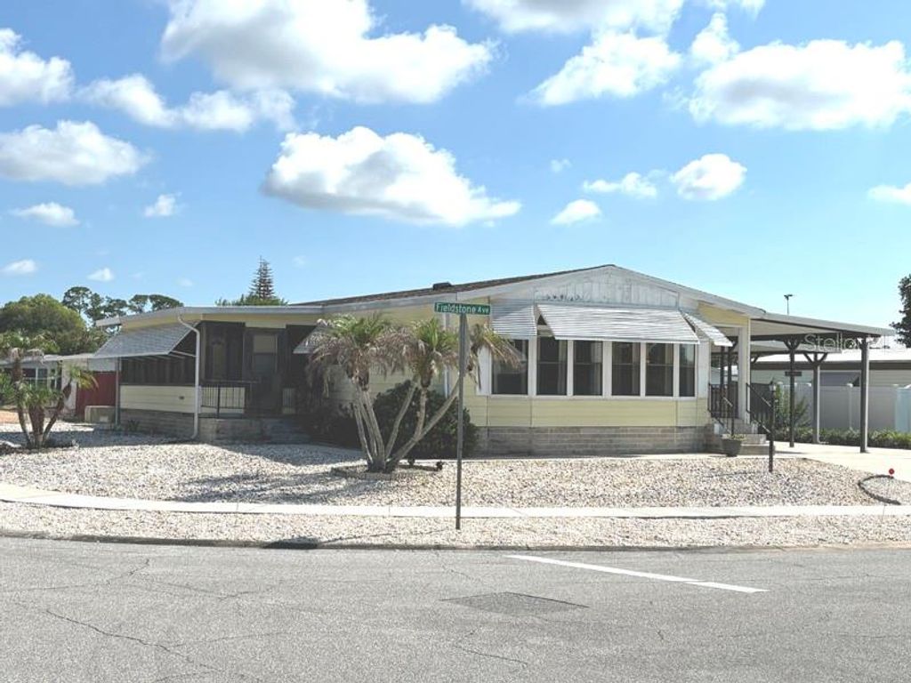 Photo of 719 Fieldstone Avenue, Port Orange, FL 32129 (MLS # V4949974)