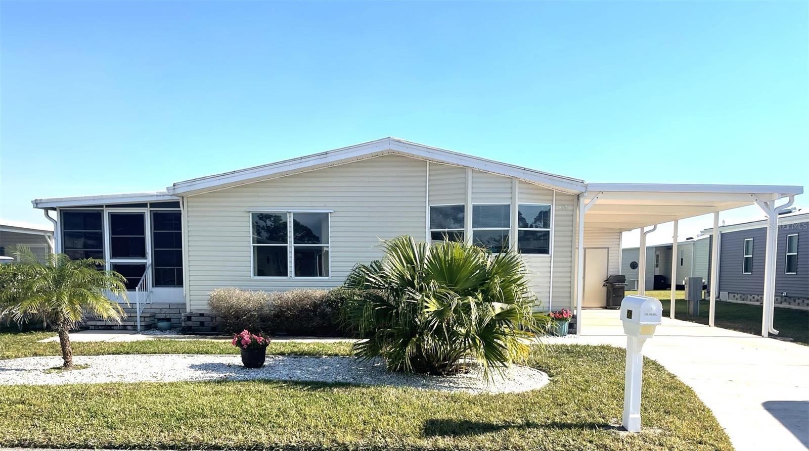 Nicely maintained 1994 home in the premier retirement community of Harbor Isles. Land owned, pet friendly, with resort like amenities and a myriad of activities year round. There is a marina with boat slips, boat launch, fishing station, Canoe/Kayak storage and launch, pavilion and an active boat club. Updates include New plumbing 2025, Carport and shed 2024, Hot water heater 2024. A/C 2018. The roof is membrane, replaced 2007 and in great condition. The home has lovely laminate throughout the living area. The kitchen is bright and enjoys a new range, new sink and faucet. The primary bedroom is large with an an ensuite bath and good size closet. The guest bedroom is spacious with room to add a comfy chair for reading and just steps away from the guest bath. The floorplan is open and great for entertaining or quiet evenings. For more elbow room you have direct access to the Florida room through sliding doors from the living room. Another nice space with more seating. The curb appeal is welcoming and the carport has plenty of room for a vehicle and golf cart. The home is being offered furnished. Harbor Isles is convenient to beaches, shopping, dining, Atlanta Braves ball field, downtown Wellen Park, Sunseeker Resort, golf courses, entertainment, interstate, airports and more. Call today for your personal tour!