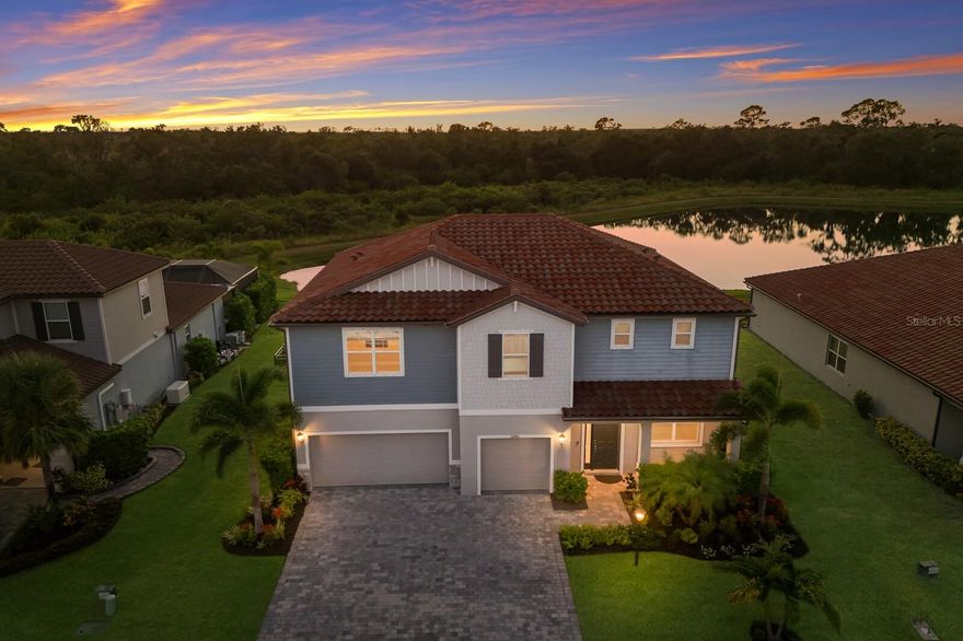 Step into this BEAUTIFULLY designed Topaz model by Meritage Homes, offering 5 bedrooms, 3 baths, and a 3 car garage with 3,194 sq. ft. of thoughtfully crafted living space. Located in the highly desirable community of Savanna in Lakewood Ranch, this home perfectly blends MODERN comfort, functionality, and SERENE pond views. As you enter, you’re greeted by a FLEX room, ideal for a home office, workout space, or playroom depending what fits your lifestyle. The heart of the home features a spacious open-concept kitchen and living area, perfect for entertaining or family gatherings. The chef’s kitchen is equipped with wood cabinetry, a stylish tiled backsplash, BUILT-IN oven, gas cooktop, stainless steel appliances, and a large center island with seating overlooking the living room. The sliding glass doors lead you to peaceful views of the pond, creating a perfect place to unwind after a long day. The first floor also includes a guest bedroom and a full bath with a tub/shower combo, providing privacy and comfort for guests. Upstairs, you’ll find the spacious primary suite featuring a walk-in closet and an ensuite bathroom with dual sinks and a glass tiled shower. Three additional bedrooms with walk-in closets, share a full bathroom with dual vanities and a tub/shower combination. The large LOFT area is perfect for movie nights, game time, or a second family room, offering plenty of space for everyone. The laundry room is conveniently located upstairs for added ease. Step outside to your fully FENCED backyard, where you can enjoy peaceful pond views and gorgeous SUNSETS. There’s ample space for kids or pets to play and even room to design your dream pool in the future. Savanna is a fabulous community with LOW HOA resort-style amenities such as a clubhouse, swimming pool, state-of-the-art fitness center, basketball courts, playground, dog park and numerous walking paths. Lakewood Ranch is known for their A+ rated school system and is perfectly located just a short ride to downtown Sarasota, St. Pete, world class shopping, fine dining and the FAMOUS Gulf beaches! Don't wait to make this your home and begin your FLORIDA Lifestyle!