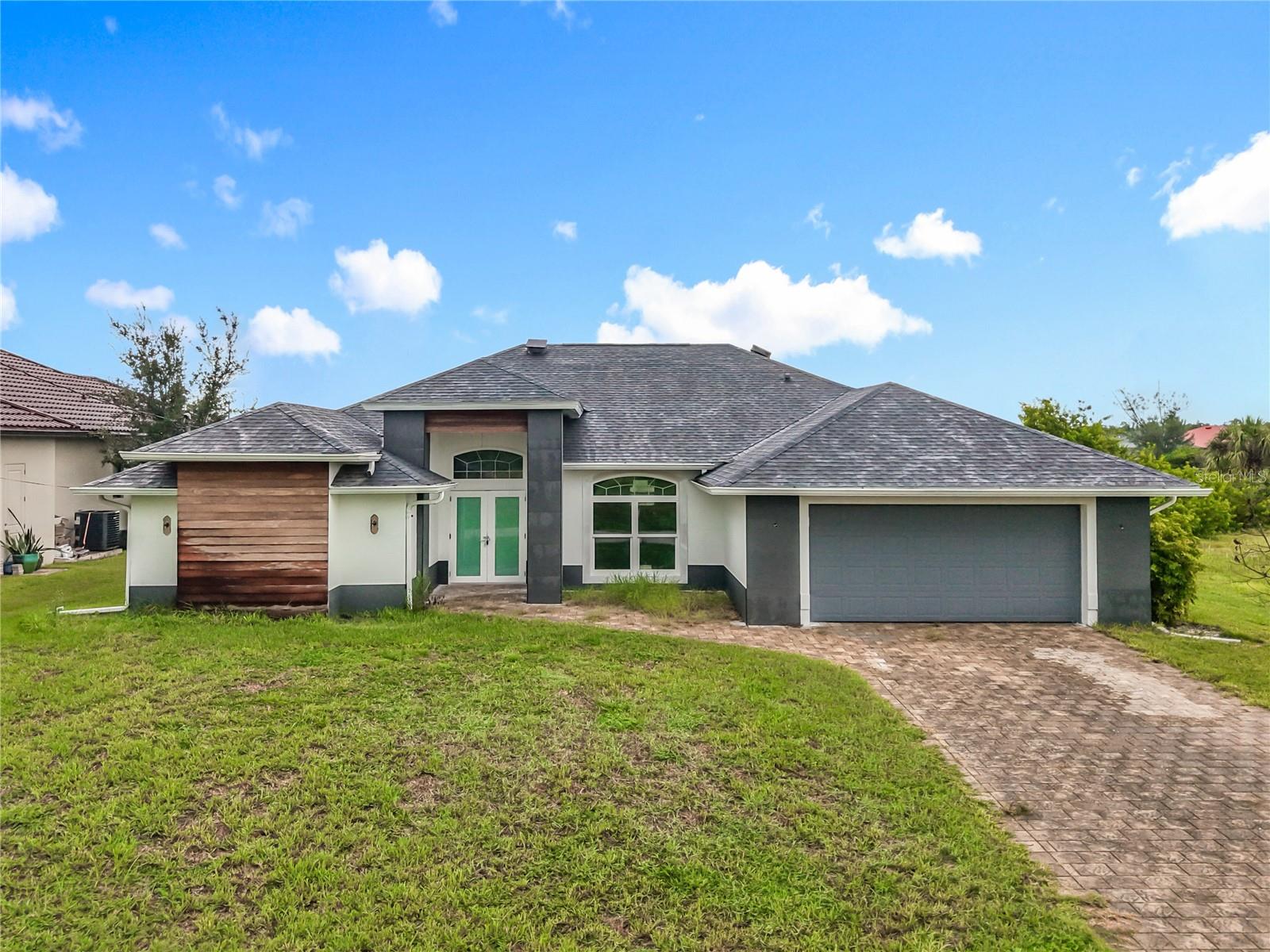 Waterfront Pool Home – This spacious 3-bedroom, 2-bath split floor plan home offers an open-concept layout designed for comfort and entertaining. The property features a private pool and a large yard, all overlooking the water—ideal for relaxing or enjoying Florida’s outdoor lifestyle. Inside, the home boasts bright living spaces with a flowing layout that seamlessly connects the kitchen, dining area, and family room. The split bedroom plan provides privacy, with the primary suite separated from the guest bedrooms. This property needs renovation and updating, making it the perfect canvas for customization. With its prime waterfront location, generous lot size, and desirable layout, it’s an excellent investment opportunity or future forever home.