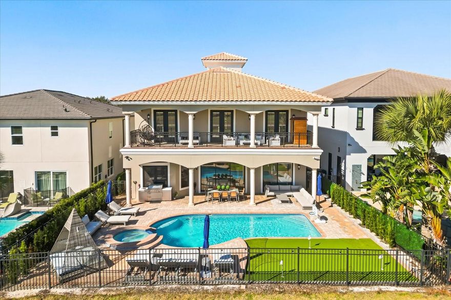 EASY TO SHOW Find the Hidden Mickey! Luxury, lifestyle and legacy is what you will find at Central Florida’s Premier Lifestyle Community, Reunion Resort. Nestled inside the rolling hills of the Nicklaus Golf course you will find a stunning display of character and comfort at 7862 Palmilla Court a Reunion Membership Home.  This FULLY FURNISHED golf course view home is located in the ultra-exclusive Legends Corner, which is one of the most highly desirable portions of the community.  The property radiates curb appeal and stands out from others with recent exterior paint, a freshly pressure washed roof and backyard space that makes you envy of the neighborhood.  Once inside you are greeted with views, design and massive ceiling heights that are hard to miss.  The entire house has been re-imagined from flooring, to paint, and from furniture to fun, and no area has been left behind.  Outdoor space includes new pavers, patio furniture, completely resurfaced pool and spa, including the newly installed Mickey putting green! With this unique floor plan, you will find an expansive first floor open concept that creates multiple gathering spaces.  The front room has oversized windows that let in a ton of natural light and invite you to play a friendly game of billiards. Continuing through the foyer, you will find an area set aside specifically for organized storage. The property also has a unique home office feature for those who need a quiet space to take care of the business of the day or to steal a little computer time.  The lure of the golf course and patio view pull you through the home into the living space and dining area.  You will find a bright and airy kitchen with a private wine closet and pantry with new updated modern appliances, fresh cabinets and new countertops.  The home has all new flooring and specially designed lighting.  The first-floor oversized master includes a double vanity, soaking tub and large private closet. Once upstairs you are greeted by a gathering space that is perfect for entertaining.  Watching the big game, your favorite family movie or catching up on the weather report at home is easy to do in this property because you will have your very own private in-home theater and multi-purpose media space.  You will also find three additionally professionally designed bedrooms that include all new furniture and flooring.  One of them doubling as a second master with a private balcony perch. Each of the rooms has closet space and a private restroom for occupants. This home just feels different.  There is also a very special room set aside that transports little ones to a magical space that makes them feel like they are amongst the friendly faces of royalty.  The large second floor balcony space spans the width of the home and includes lounging furniture along with a SAUNA and expansive breath-taking views of the 11th hole of the Nicklaus golf course.  It has been called the "perfect spot to hideaway."  From floor to ceiling and from the front door to the first putting green this home awaits!  Home is being sold FURNISHED, garage is finished and includes game room and golf cart parking. Reunion has everything you want in a community including 3 signature golf courses, world class dining, waterparks, lazy river, water slides, firework viewing areas, tree lined streets, dog park, playground, driving range, golf simulator, member events, in-resort shuttle service, and event space. Live the resort lifestyle like a VIP. REUNION