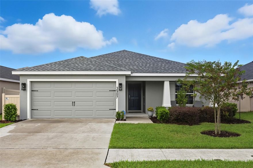 Welcome to this beautifully maintained Highland Homes Parker model in the Villamar community of Winter Haven. Built in December 2023, this single story block home offers 4 bedrooms, 2 bathrooms, and 1,715 square feet of well designed living space. The Parker floor plan features Craftsman style curb appeal, vaulted ceilings, and an open layout filled with natural light. The kitchen offers stone gray shaker cabinets, Silestone countertops, Samsung stainless steel appliances, a counter height island, walk-in-pantry, and a dining café overlooking the gathering room. Luxury vinyl plank floors extend through the main areas and one bedroom, with soft carpet in the remaining three. The owner’s suite includes dual vanities, a garden tub, a tiled shower, a closeted toilet, and a walk in wardrobe. Updates include an ADT security system, Rain King water softener, vinyl fence, new attic insulation, and repairs completed before the builder warranty expired. Roof, HVAC, and water heater all 2023. Highland Homes is no longer building this model in Villamar, making this a rare find near shopping, dining, and top rated schools.