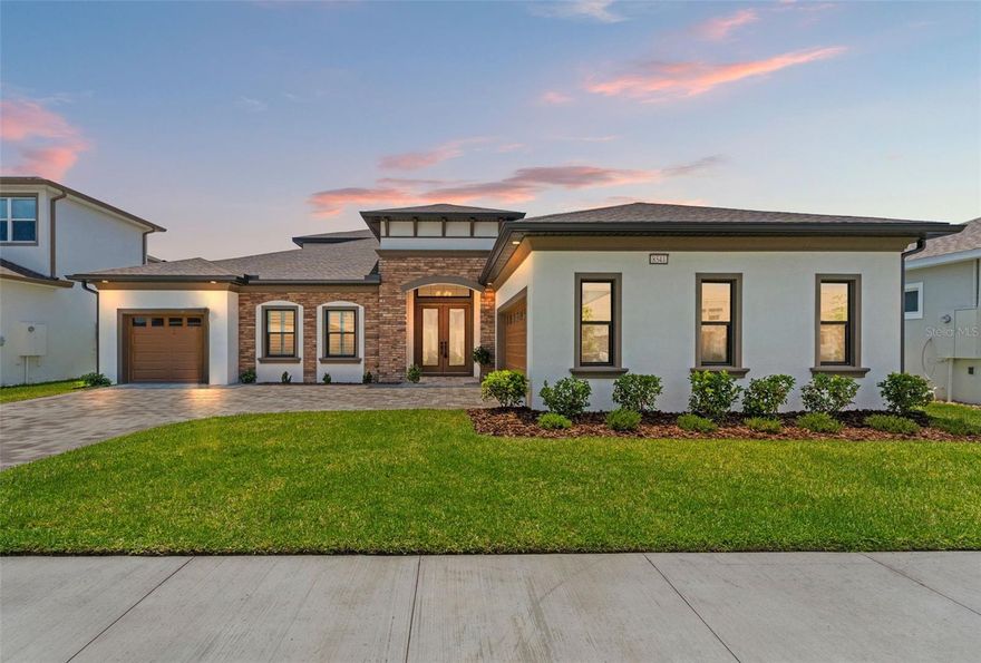 Welcome to Robyns Cove at Epperson! Built by Biscayne Homes, this charming contemporary pool home offers modern living at its finest. The Bismark 3 floor plan home features six bedrooms, four full bathrooms plus a powder room/half bath, a screened-in salt water pool,three garage spaces, a large bonus room on the second floor with balcony and a view of the pond. Upon entering the foyer, your first stop is the flex room on the left, currently staged as a second living room, but can also be a home office, etc. Featuring an incredible kitchen with quartz countertops, double ovens, apron style sink, modern cabinetry, an electric cooktop, a walk-in pantry and stainless steel appliances. This kitchen is upgraded with additional cabinetry and a third cabinet space with dry bar that includes wine storage and double mini beverage coolers. The open kitchen faces the dining room, living room and oversized sliding glass doors that lead to the pool and covered lanai. The flooring includes ceramic tile on the first floor with carpet in the bedrooms, luxury vinyl plank on the stairs and carpet in the bonus room. Four of the six bedrooms are on the first floor, including the Owners Suite, two bedrooms with a "jack & Jill" bathroom, and the fourth bathroom separate from the rest of the house (idea for multigenerational living).The Owners Suite has a view of the pond, a spacious Owners bathroom, including double sinks and a bathtub plus separate walk-in shower, with and oversized walk-in closet. The second floor has two bedrooms (total 6), with a secondary "jack and Jill" bathroom that has separate sinks for each. The whole home is upgraded with shutters and all bedrooms have ceiling fans. The salt water pool is surrounded with a paver deck and a beautiful view of the pond. This home has a north facing front door, which means you get a view of the sunrise and sunset from the pool area. Welcome to Florida! You get to enjoy pink and purple sunsets every day! Life at the Lagoon is like nothing else. This home is in close proximity to Publix Plaza at Innovation Springs, Starbucks and Chick Oil-A. The Epperson HOA includes cable + the fastest internet in the nation, Ultra-Fi. The closest Elementary Schools are In Prep Academy, Watergrass Elementary & Wesley Chapel Elementary, and Kirkland K-8. The closest middle school is Thomas Weightman Middle School. The nearest high schools are Kirkland Academy of Innovation High School and Wesley Chapel HS. The community features “Street Leaf” lights, home of the first Crystal Lagoon, where Residents have access to Elam Park & the dock at King Lake, paddle boarding, dog parks, and golf cart paths, kayaking, a wibit obstacle course, Cabanas, AquaBanas, Sandy Beaches, Live Music Events, Swim Up Bar and Resident Only Events. The Lagoon is like an Outdoor Clubhouse. The Holiday/Seasonal Events include Trivia Night, Family Night, Movies on the Lawn, Sounds of Summer (live music series), Karaoke, Pumpkin Patch in November, Golf Cart parades, Cinco de Mayo Resident only celebration, Fourth of July Resident Only celebration and much more. This home is located about 10 minutes away from KRATE (the new outdoor mall), 35 minutes north of Downtown Tampa, 45 minutes from Tampa International Airport, and 90 minutes from Orlando and Walt Disney World. You are ready for LIFE AT THE LAGOON!