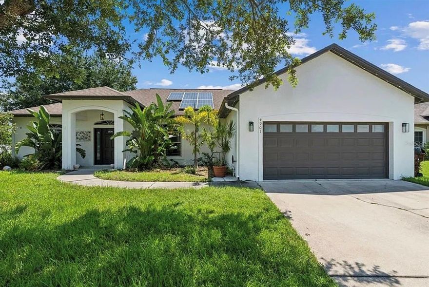 One or more photo(s) has been virtually staged. Welcome to this beautifully maintained corner-lot home in the desirable Canoe Creek Lakes community, perfect for families seeking space, comfort, and convenience. Nestled on a quiet cul-de-sac with peaceful lake views, this home offers a safe and serene environment while being just minutes from everything a family needs. As you enter, you’re welcomed by a bright and inviting layout featuring double glass doors leading to a private home office or flex space, ideal for working from home or creating a playroom. The open-concept living and dining areas are filled with natural light, creating a warm and welcoming space for everyday living and family gatherings. The kitchen is both functional and spacious, with wood cabinetry, ample counter space, a large pantry, and all appliances included, even the washer and dryer. With no carpet throughout and pets welcome, this home is designed for easy living. The fully fenced backyard and screened lanai provide the perfect space for kids and pets to play, relax, and enjoy outdoor time safely. The oversized primary suite offers a peaceful retreat with his and her closets, dual sinks, a soaking tub, separate shower, and a private toilet area. A split floor plan ensures privacy, with additional bedrooms located on the opposite side of the home along with a full bathroom that also serves as a convenient cabana bath with direct backyard access. Additional highlights include a new roof installed in December 2024, a two-car garage, and an extended driveway. Located near highly rated schools, with quick and easy access to the Florida Turnpike, as well as nearby shopping, dining, and everyday conveniences, this home is ideal for families looking for both comfort and accessibility in a well-connected community.