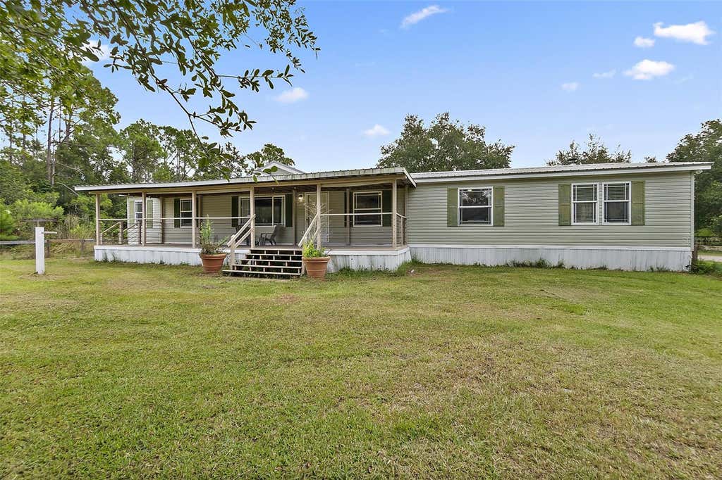 Photo of 2055 County Road 75, Bunnell, FL 32110 (MLS # FC320719)
