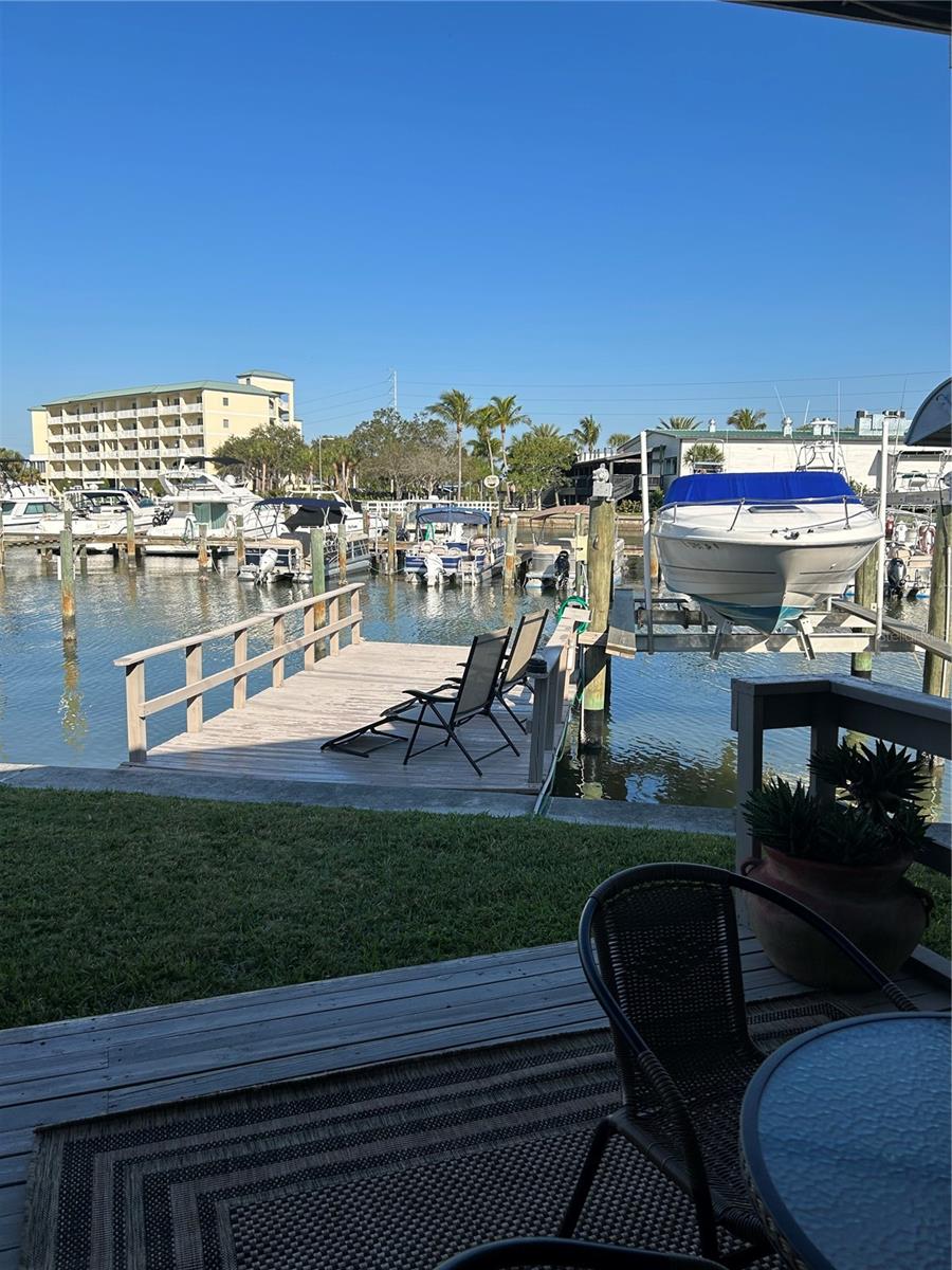 Under contract-accepting backup offers. *WATERFRONT, DOCK, 10,000 LB BOAT LIFT* PREVIOUS BUYER BACKED OUT 4 DAYS BEFORE CLOSING DUE TO CHANGES IN PERSONAL LIFE. Welcome to affordable waterfront living. You own the land in this community. New HVAC ducts replaced 2020, 30 gallon hot water heater 2021, new laminated flooring 2018, in bedrooms 2019, 2 car carport with extended side to open car door easily, metal roof, bedrooms and baths updated, new paint throughout, new dishwasher 2018, newer refrigerator and stove, washer and dryer in shed, tool shed, boat lift installed 2021. New siding, windows and awnings 2019. HOA includes water, grass mowing, garbage pickup twice a week, clubhouse, pool, on-site management/maintenance, and even a pick up truck to use for home projects.