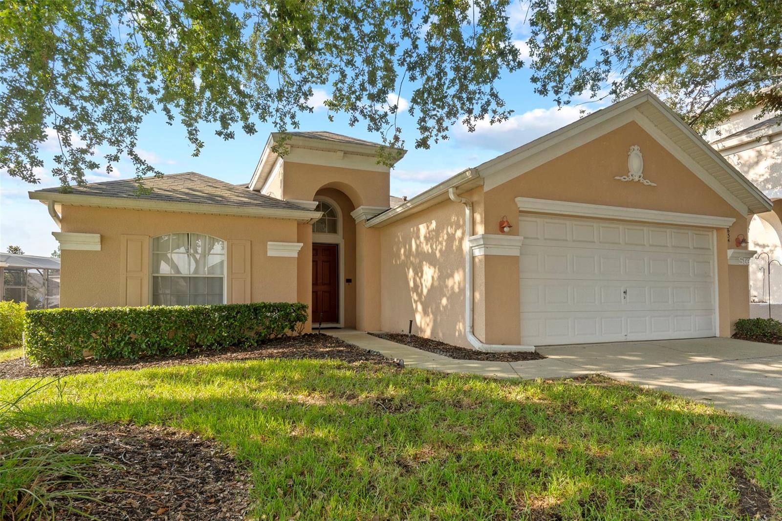 Located in the desirable community of Calabay Parc, this beautifully upgraded 3-bedroom, 2.5-bathroom home offers style, functionality, and effortless Florida living. Whether you're searching for a primary residence, a vacation getaway, or an income-producing rental, this home checks every box and more.
From the moment you walk through the front door, you're greeted by soaring ceilings, upgraded light fixtures, and beautiful wood-look tile flooring that runs throughout the home. The spacious living room opens to an oversized pool deck through large sliding glass doors, creating a seamless blend of indoor and outdoor living. Just off the living room, the kitchen is both modern and inviting, showcasing sleek finishes, stainless steel appliances, and a center island perfect for prepping and entertaining. A second set of sliding glass doors connects the kitchen to the pool area, making this home ideal for gatherings and everyday enjoyment.
On the right side of the home, the expansive primary suite offers views of the pool and includes two walk-in closets, one with a custom-built California Closet system. The en-suite bathroom is spacious and well-appointed with double sinks, a luxurious soaker tub, and a walk-in shower.
On the left side of the home, two generously sized guest bedrooms share a fully renovated bathroom with stylish updates. The second bedroom features a large arched window that brings in natural light and offers a charming view of the front of the home. The third bedroom provides plenty of space and is outfitted with a sleek bladeless ceiling fan for added comfort. The shared bathroom has been thoughtfully redesigned with a brand-new vanity, upgraded tile flooring, and a walk-in shower with elegant gold accents that create a polished and modern feel.
Step outside to your private backyard oasis featuring an expansive, fully screened-in pool area with privacy screens and no rear neighbors. The oversized deck provides ample space for lounging or dining under the shaded lanai. A convenient half bath is located just off the pool, making outdoor entertaining even easier.
Additional highlights include a dedicated laundry room with a brand-new Samsung washer and dryer and shelving, as well as a freshly epoxy-sealed two-car garage. The roof was replaced in 2019, and the homeowners association includes lawn care, allowing for low-maintenance living.
Perfectly positioned off US-27 with easy access to I-4, you are just minutes from Orlando’s major attractions, shopping, dining, and entertainment.
Stylish, move-in ready, and full of thoughtful upgrades, 634 Montara Drive is the perfect place to call home. Come experience it for yourself.