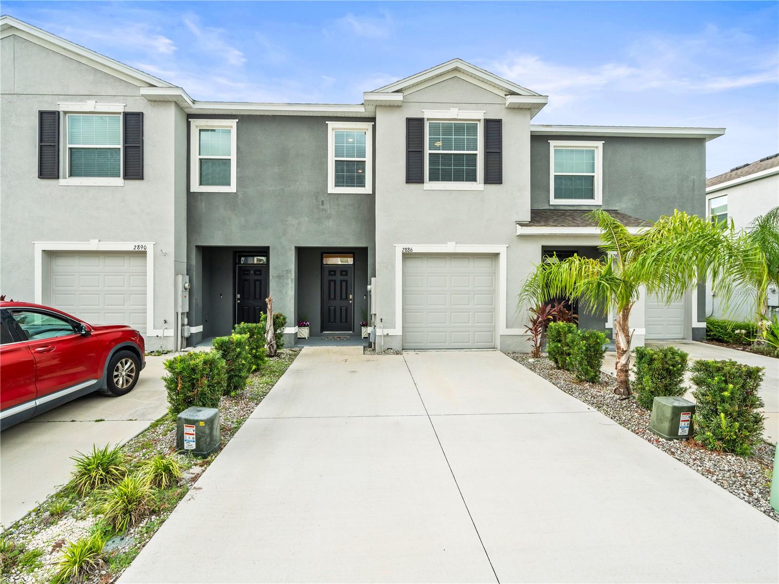 Welcome to this stunning 2021-built townhome in The Preserve by DR Horton Homes! This modern 3-bedroom, 2.5-bath home with a 1-car garage combines style, comfort, and functionality in one of the community’s most desirable locations.
Step inside to an open-concept first floor featuring elegant tile flooring, soaring ceilings, and a bright, inviting layout. The gourmet kitchen boasts granite countertops, stainless steel appliances, and a central island perfect for cooking or entertaining, while the dining and living areas flow seamlessly to a large covered lanai—ideal for relaxing or hosting guests. A convenient half bath completes the downstairs space.
Upstairs, the private primary suite offers dual closets (including a walk-in) and a spa-like bath with dual sinks. A wide landing leads to the guest bedrooms, one with its own walk-in closet, and a spacious full bath with a tub/shower combo. A laundry closet add everyday convenience.
This home also features a 2-car parking pad and the privacy of no rear neighbors. Located in The Preserve, an exclusive community, residents enjoy resort-style living with unmatched amenities including a clubhouse, 24-hour fitness center, heated resort pool, Olympic-size lap pool, paved sun deck with shaded cabanas, soccer field, basketball court, dog park, playground, picnic areas, and scenic walking trails with private access to the Suncoast Bike Trail.
Zoned for top-rated A schools, the property is perfectly situated near restaurants, grocery stores, shopping centers, Wiregrass Mall, Tampa Premium Outlets, and offers quick access to SR54 and the Suncoast Parkway for an easy commute to Tampa International Airport and Downtown Tampa.
With its contemporary finishes, smart layout, and unbeatable location, this townhome is move-in ready and waiting for you!
