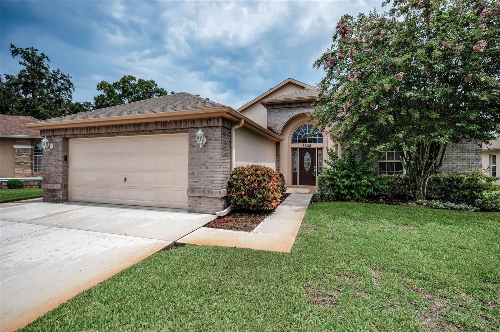 IN TIMBER GREENS A 55+ GATED GOLF COURSE COMMUNITY....3 BEDROOMS 2 BATH AND 2 CAR GARAGE IS LOCATED ON A CUL-DE SAC ON THE 5TH TEE. Experience the comfort and convenience in this home, with tranquil surroundings and an abundance of amenities offered in this community. Living room/dining room, Eat in kitchen, family room. Inside Laundry with washer and dryer, Enjoy the views on the Large, enclosed Lanai overlooking the golf course and pond. Timber Greens is more than just a community—it's a lifestyle. With access to an 18-hole par 71 golf course, clubhouse, pro shop, community pool, and spa, as well as tennis, pickle ball, bocce, and shuffleboard courts, there's never a shortage of activities. Engage in arts and crafts, dine at the 19th Hole Bar and Grill, or enjoy an evening with friends in the card room. Conveniently located, you have an array of amenities at your fingertips while maintaining the tranquility. Convenient access to shopping, medical facilities, dining, parks, beaches and more. Come see this Beautiful Home!