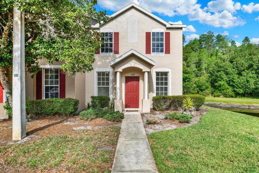 Welcome to this move-in-ready townhome in the gated community of Sedgwick Village at Meadow Pointe II. This functional two-story floor plan features 3 bedrooms, 2.5 bathrooms, and a spacious downstairs living area. Significant updates include a brand-new HVAC system (January 2026), fresh interior paint throughout, and new carpeting. The kitchen is equipped with a full suite of brand-new stainless steel appliances. A standout feature is the PRIMARY BATHROOM, which was recently remodeled with a modern tile surround and a glass partition wall. OUtside, enjoy 2 assigned parking spots right in front, a screened enclosed back porch with storage closet and a peaceful view of the pond and conservation. Residents of Meadow Pointe II enjoy access to a fabulous clubhouse featuring a swimming pool, pickleball/tennis courts, and recreational facilities. Ideally located near the PHSC Wiregrass Campus, The Shops at Wiregrass, and the Tampa Bay Premium Outlets, this home offers convenience and a refreshed living space. Schedule your private showing today!