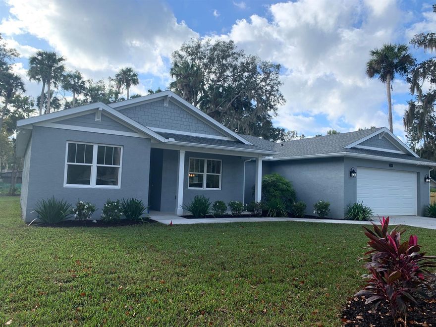 The Perfect Home ... Come Live the Florida Dream in this Custom Built Home on a Beautifully Treed and Landscaped 106' x 195' Lot - Large enough to Create Your Own Mini Retreat with Space for Out Buildings, RV or Boat Parking, a Pool and All Your Toys! Boasting 1881 Living SF and 2891 Total SF, this Open Concept Plan incorporates your Indoor and Outdoor Living Spaces with a 19' x 5' Covered Front Porch and a 28.8 x 9.4 Covered Rear Lanai. Quality Construction with Attention to Details: 9'4 Flat Ceiling Heights throughout and Tray Ceilings in Living Room and Master BR. 8' High Doors throughout, French Doors w/Built-in Mini Blinds. Wood Cabinetry with Full Extension Self Soft Close Doors and Drawers. Grade 3 Exotic Granite Counter Tops. Stainless Steel Appliances and Range Hood Vented to Outside. Built-in Microwave and Pantry. Extra Large Guest Bathroom with Kohler Soaker Tub/Shower. Architect XPR Parkay Brand Luxury Vinyl Tile Flooring throughout with 12" x 24" Tile in Bathrooms. Built-in Alcoves. Recessed Lighting. 8.10 x 7.8 Walk-in Master Closet. All Other Closet Doors are 8' High Allowing Extra Storage Space. Lifetime Architectural Shingles. Gutters. Partially Fenced. 10' x 8' Insulated Steel Garage Door on Oversized 22.9 x 24.4 Garage with Truss System that offers Attic Storage Area. Garage Opener Remotes and Keypad Entry w/WIFI Ready Door Opener Capability. Sprinkler System. Builder Offering $2000 Allowance on Full Price Contract for Buyers to Customize the Cabinetry Hardware, Closet Shelving, Bathroom Towel-bars and Kitchen Backsplash Tile (Inclusive of Materials and Labor). Tucked in an Ideal Location, this Quiet, Non-HOA Community of Corbin Park has Easy Access to the Beach (Under 4 Miles), New Smyrna Beach Shopping, Restaurants, Medical Facilities and I-95. Disclosures: Co-Owner is a Licensed Real Estate Agent. All Information and Measurements Deemed to be Accurate; Buyer to Verify. Come feel the Ambiance of this Home Sweet Home! - Make It Yours! ;Water: City
