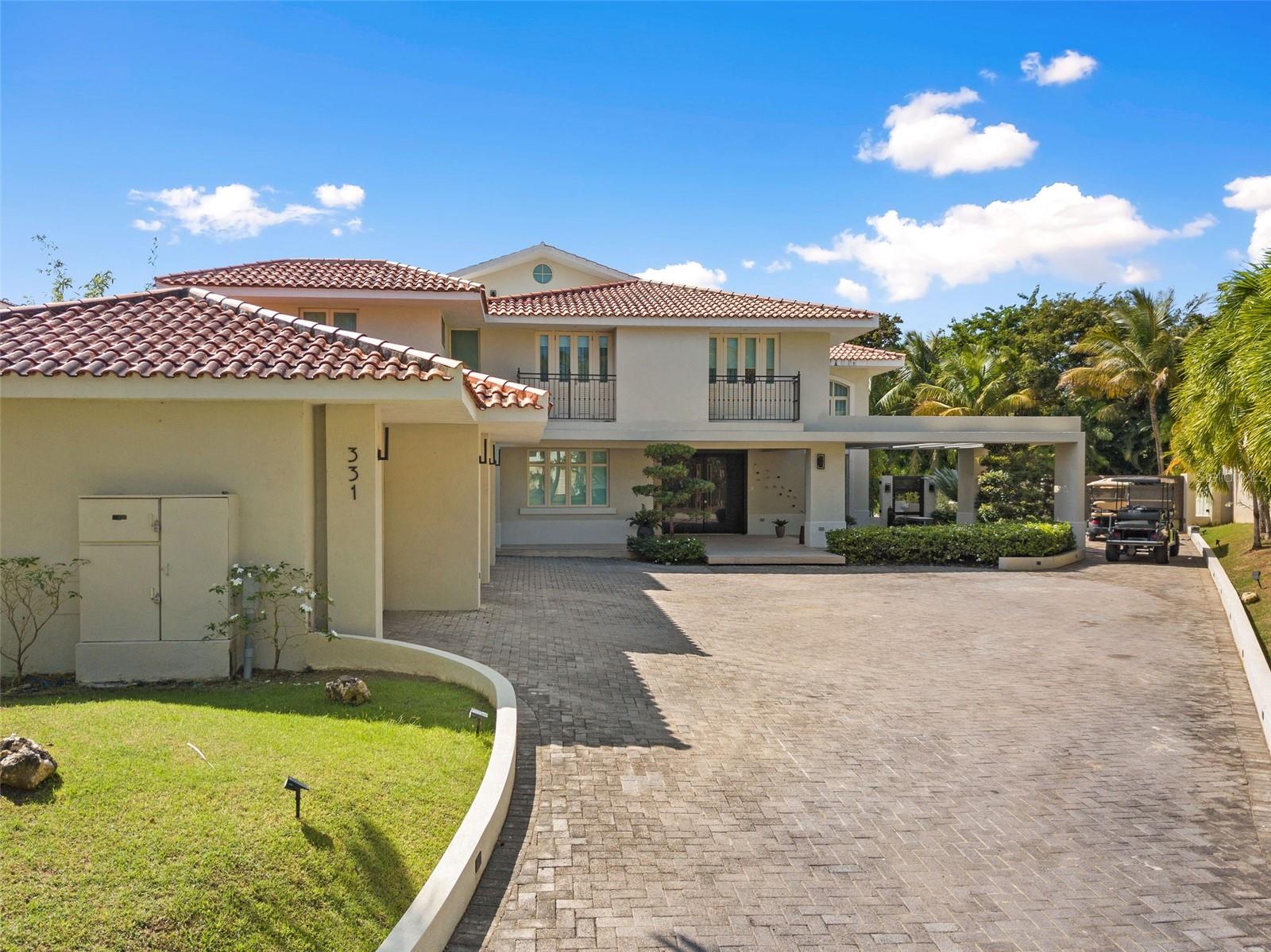 One of a kind Casona Carbia with a huge land lot of 2,150 square meters and 11,000 square feet of construction. Property has a unique location with direct access via golf cart to the Plantation Gym and Water Park through the privacy of its backyard. Property features: 6 bedrooms, 7 full bathrooms, 2 half baths, dedicated office space, movie theater, family room, playroom, Poliform Kitchen, huge pantry, 2 laundry rooms, 2 covered terraces, 2 open terraces, and a 3 car garage plus golf cart garage.
The Dorado Beach East community is private, gated, family friendly and offers a wide range of facilities that you can enjoy at no additional cost. The facilities include scenic pools, clay tennis courts, basketball and beach volleyball courts, a basic gym, a game room, a 3-par golf course that winds through the neighborhood, and an aviation themed park which has a custom water park and sand park.
Located within the Dorado Beach Resort, since it is a 2,000-acre natural reserve most of the communities are 1-3 miles away from the beach and Hotel. This being said, the entire resort is interconnected via golf cart trails, meaning that you can have easy access (walking or in golf cart) to the different communities and amenities within this Resort.