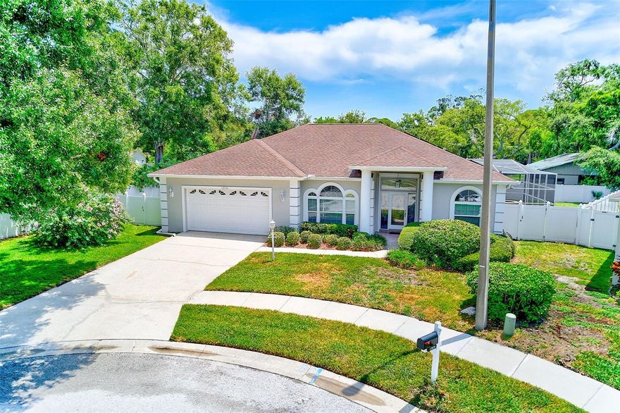 Welcome home to 13510 Oak Run Court, a beautifully maintained 3-bedroom, 3-bathroom home tucked away in a peaceful cul-de-sac street, just under two miles from the beach. Built in 1995 and located in a non-flood zone, this home blends modern comfort with coastal convenience and is perfect for those looking for space, flexibility, and peace of mind. Step inside to a bright, open living space where tall arched windows flood the living room with natural light. The home features a three-way split floor plan, offering privacy and versatility, including two primary suites, each with their own Jacuzzi tub and separate shower, making it ideal for multi-generational living or visiting guests. The kitchen is both stylish and functional, with stainless steel appliances, quartz countertops, wood cabinetry, tile backsplash and an updated gas stove and convection oven. It flows effortlessly into the dining area and adjacent family room, where built-in bookshelves and a wood-burning fireplace add charm and warmth. A dedicated office/den provides the perfect work-from-home setup or could serve as a fourth bedroom if needed. The interior laundry room offers additional convenience and tucked in pantry space. This home offers peace of mind and energy efficiency with full solar power (no batteries), a whole-house Generac gas generator, and hurricane-impact windows and/or shutters. A buried 250-gallon propane tank fuels the pool heater, stove, and oven, and there’s also a plug-in connection for an additional backup generator. The property features a six-zone irrigation system installed in 2022, along with several recent upgrades, including a new AC unit (2021), water softener system (2021), saltwater generator (2020), hot water heater (2020), and a roof replacement completed in 2015. If you’ve been searching for a newer-built home in a quiet, well-kept neighborhood close to the Gulf, this is a rare opportunity. Schedule your showing today and experience all that this home has to offer!