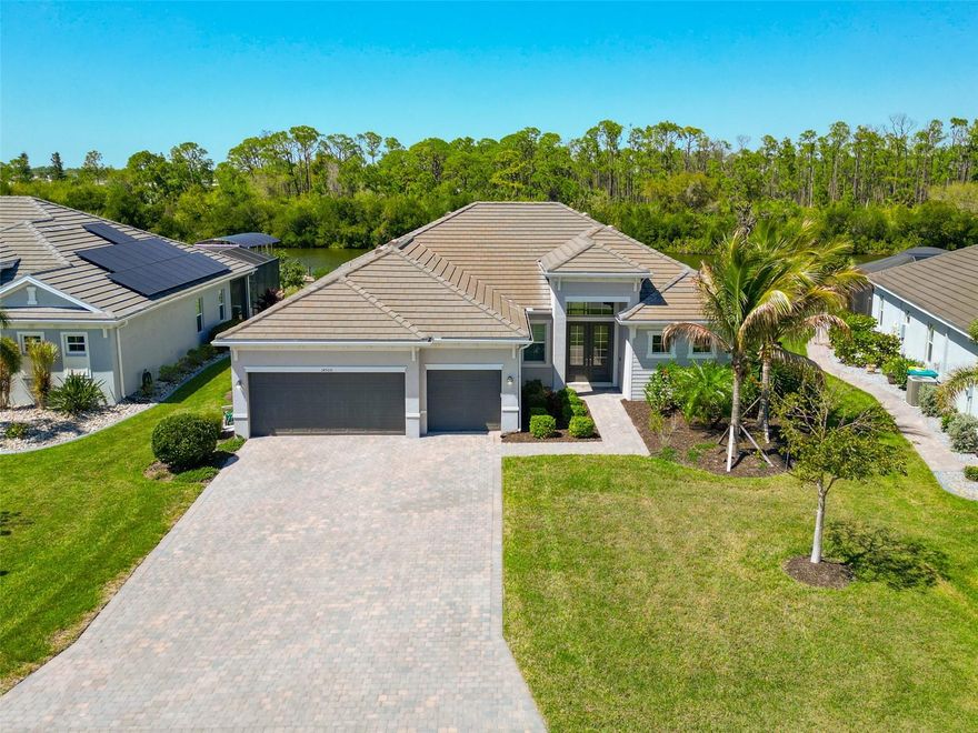 One or more photo(s) has been virtually staged. Stunning 2021-built Canal-front home with 2.5 miles from Myakka & Peace River leading to Charlotte Harbor, deep sail boat water, and NO bridges—a true boater’s dream. Offering 2,647 sqft under air, this beautifully designed residence features 3 bedrooms, 3 bathrooms, and a versatile den/office, all located in a charming gated community of just 165 homes. From the moment you enter, you are greeted with breathtaking canal views from the spacious family room, highlighted by the brand new laminate flooring, high tray ceilings and hurricane impact resistant windows and sliding glass doors that open to the screened lanai for seamless indoor-outdoor living.

The well-appointed kitchen is the heart of the home, featuring a large granite island, designer backsplash, double oven/microwave, stainless steel appliances, and abundant cabinetry. It flows effortlessly into both the formal dining and dinette areas while overlooking the main living space, making it ideal for entertaining or everyday living. The popular split-bedroom floor plan provides privacy, while the den/office with double doors offers flexibility for a home office, hobby room, or potential fourth bedroom.

Built for peace of mind, the home includes impact windows, front door, and sliders, and is situated on a well-elevated oversized lot with a berm behind the property. The home and community have remained dry through recent storms. Additional highlights include a paver driveway and a rare 3-car Air Conditioned Garage with attic stairs and a complete floor in the attic for storage. Low HOA fees cover gate access, lawn care, and landscaping.

Outdoor living is what Florida is all about, and this home delivers with a screened and pavered lanai overlooking the canal. With no bridges, you are just minutes to Charlotte Harbor and have easy boating access to Punta Gorda, the Myakka River, the Intracoastal Waterway, Boca Grande, Cabbage Key, and more. Conveniently located in the desirable Port Charlotte/Englewood area, you are close to Gulf beaches, Wellen Park, spring training facilities, Dearborn Street, golf courses, shopping, dining, and have quick access to I-75. This fast-growing area continues to offer small-town charm with endless opportunities to enjoy the Florida lifestyle.